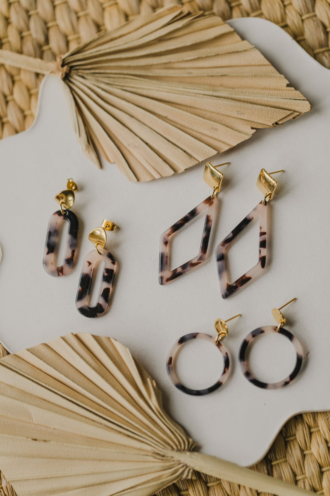 golden earrings with acrylic in white, petrol and brown