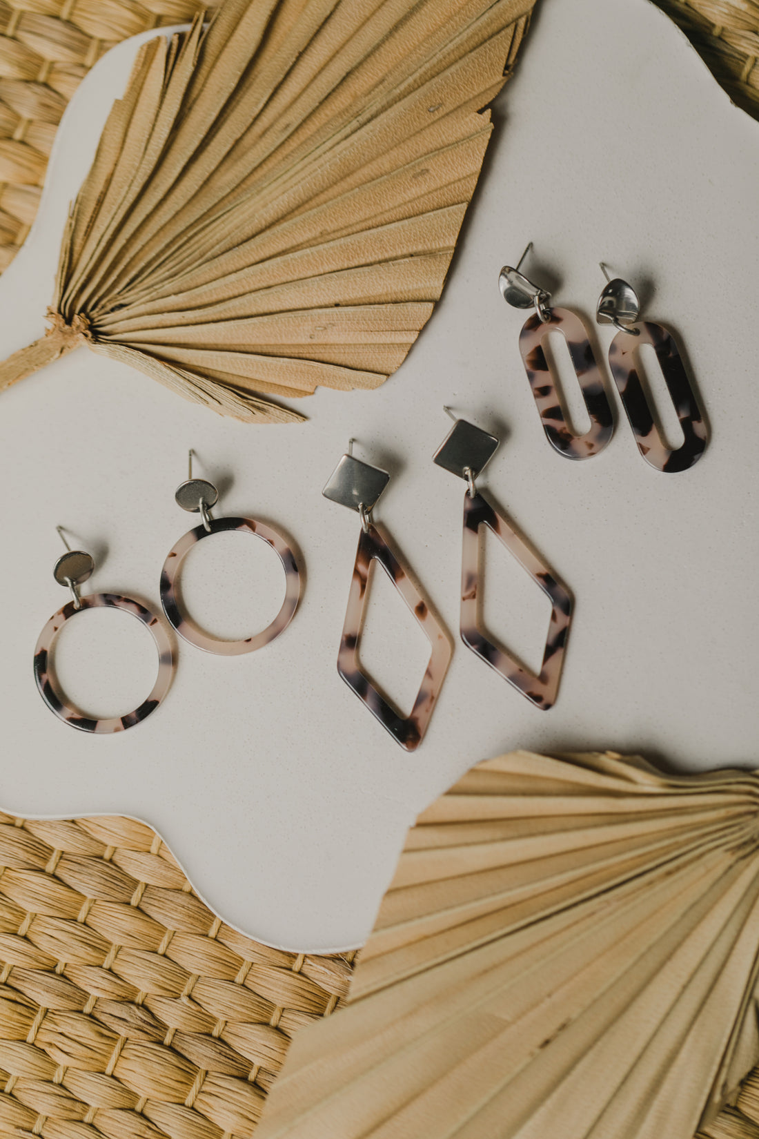 golden earrings with acrylic in white, petrol and brown