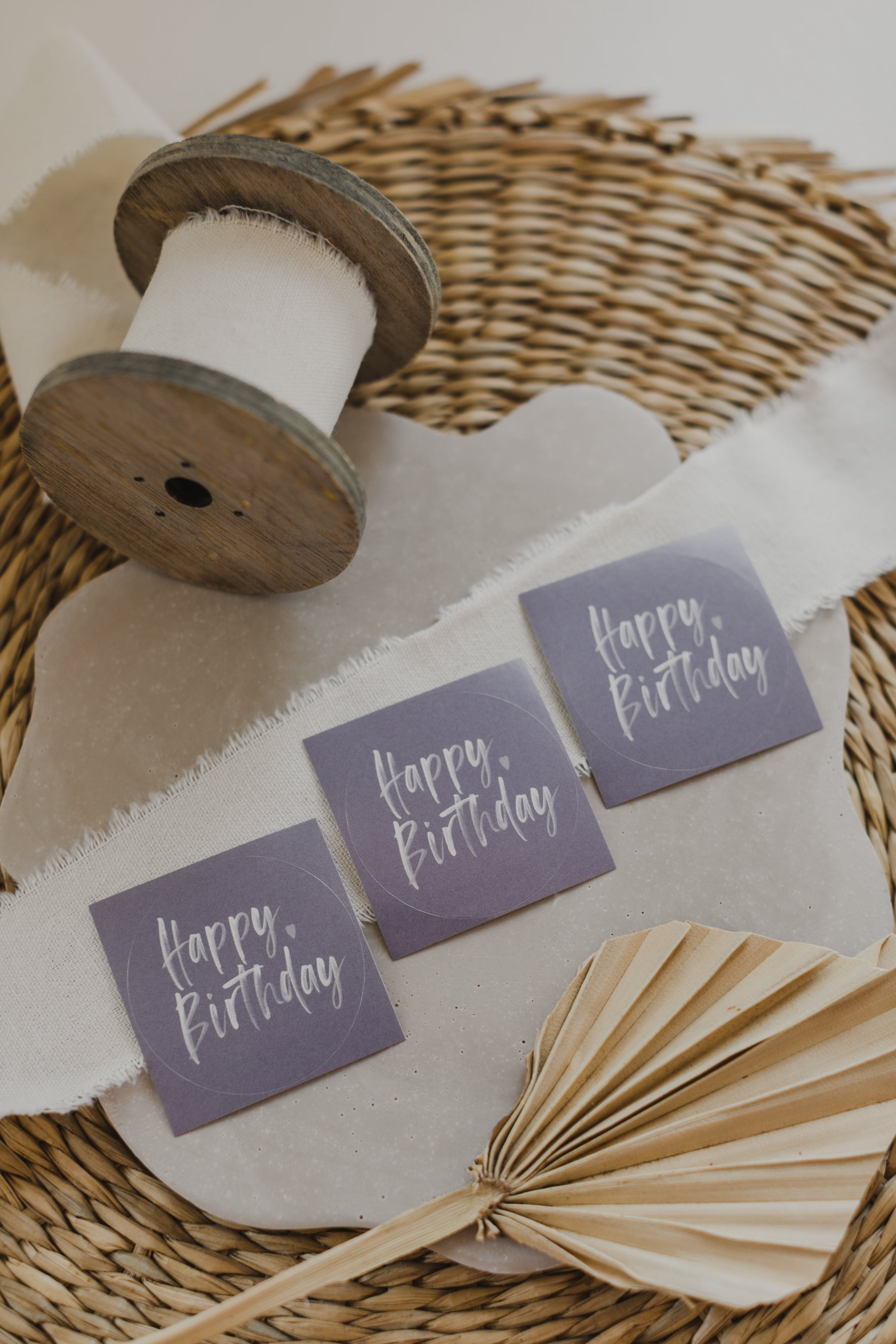 round purple stickers with the inscription &quot;Happy Birthday&quot;