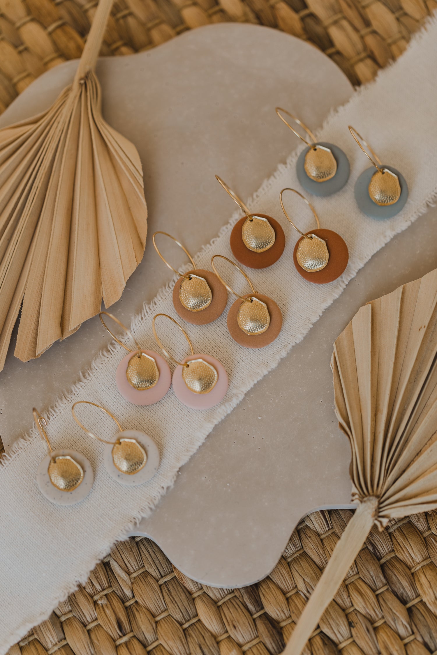 Hoop earrings with round polymer clay pendant and leaf