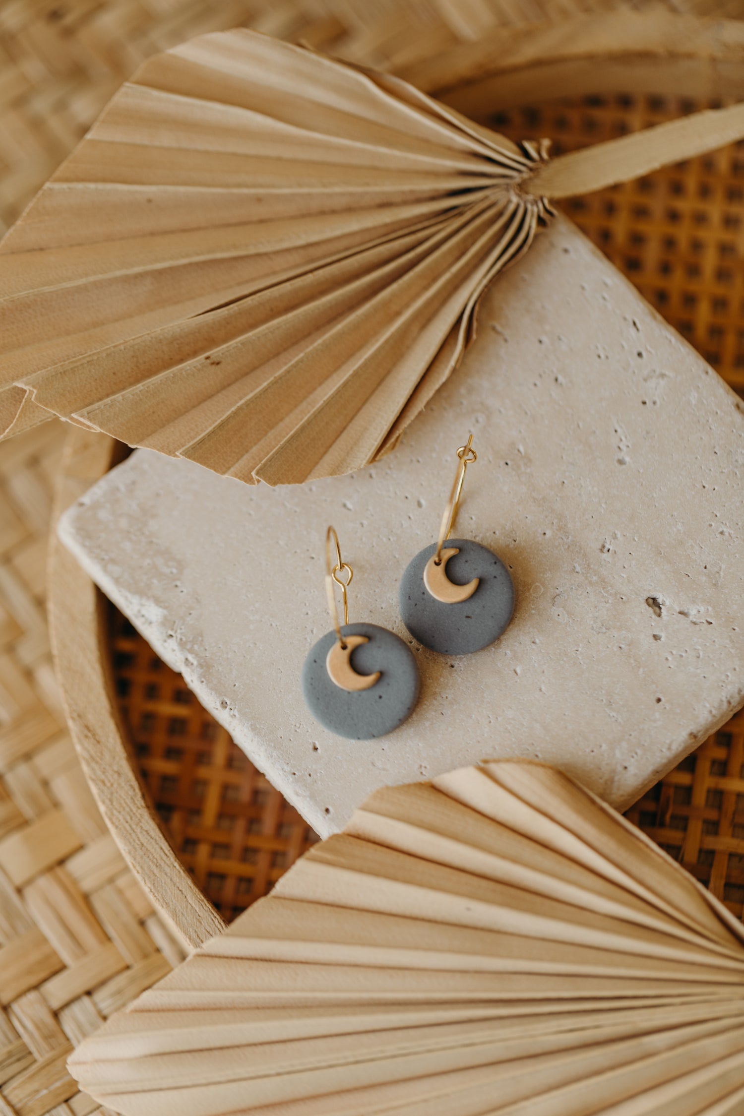 Hoop earrings with round polymer clay pendant and leaf