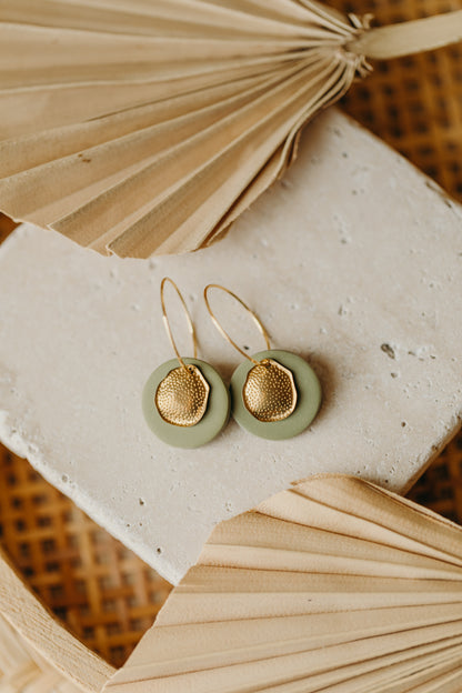 Hoop earrings with round polymer clay pendant and leaf