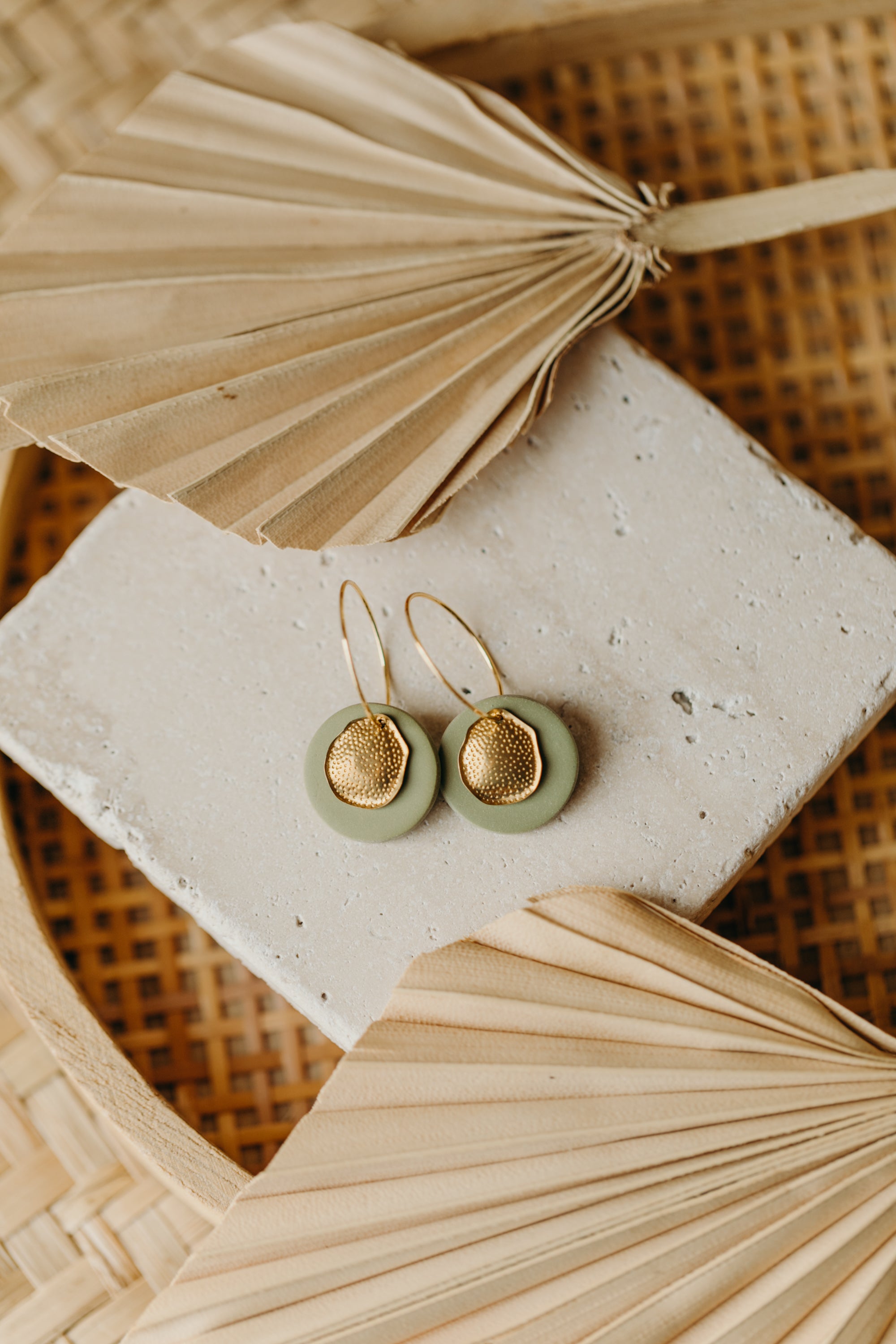 Hoop earrings with round polymer clay pendant and leaf