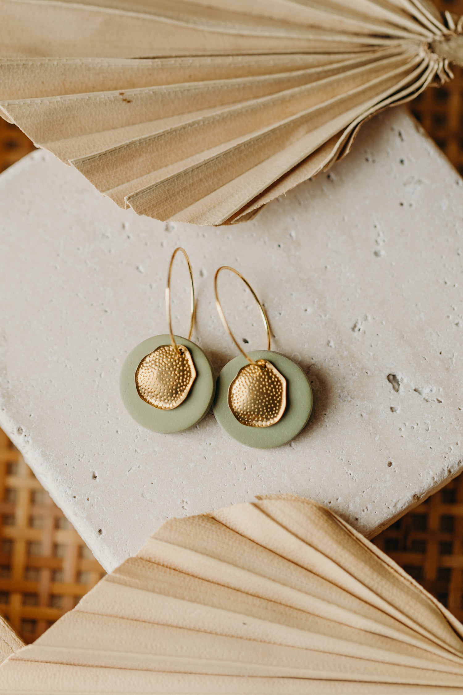 Hoop earrings with round polymer clay pendant and leaf