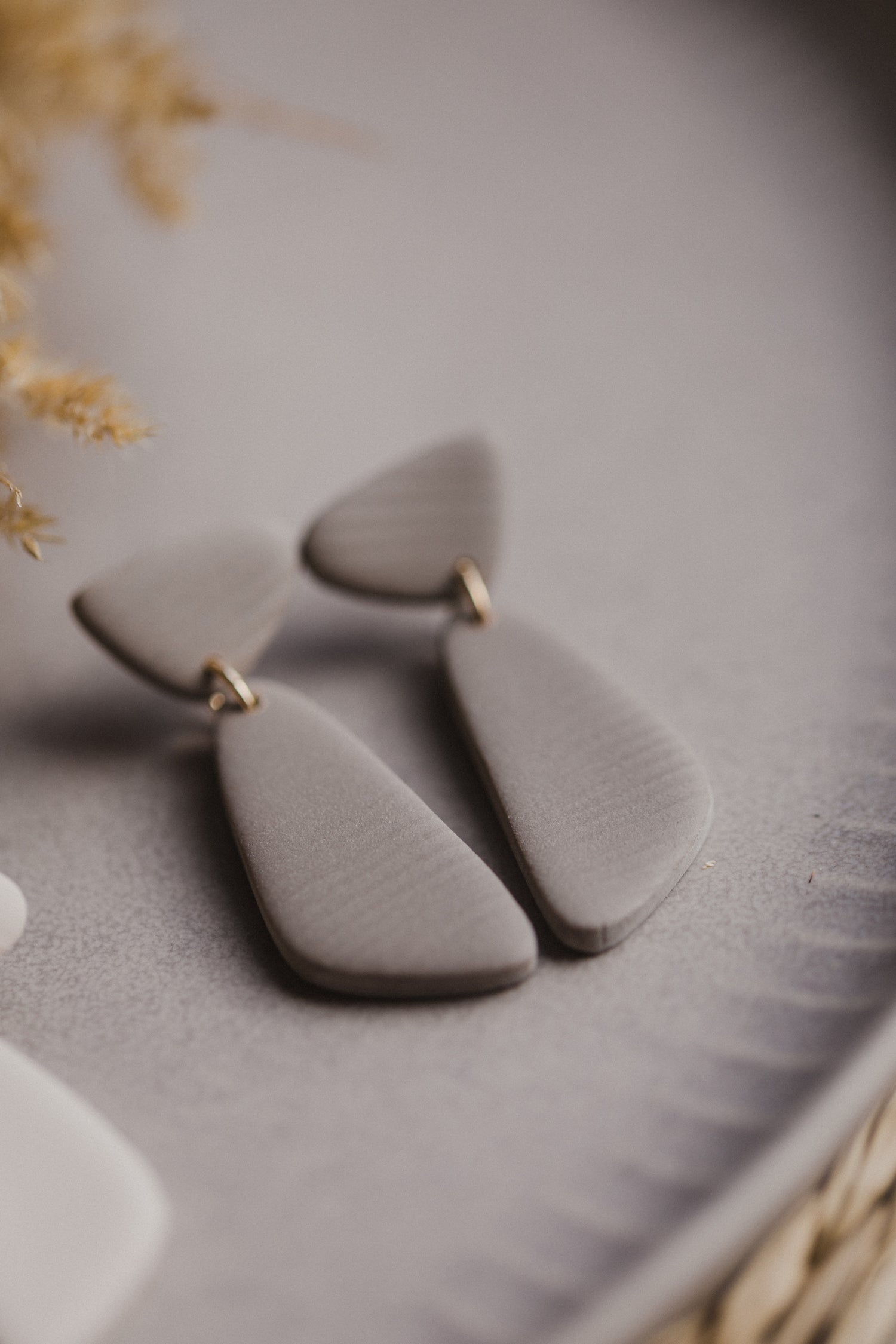 Hoop earrings with round polymer clay pendant and leaf