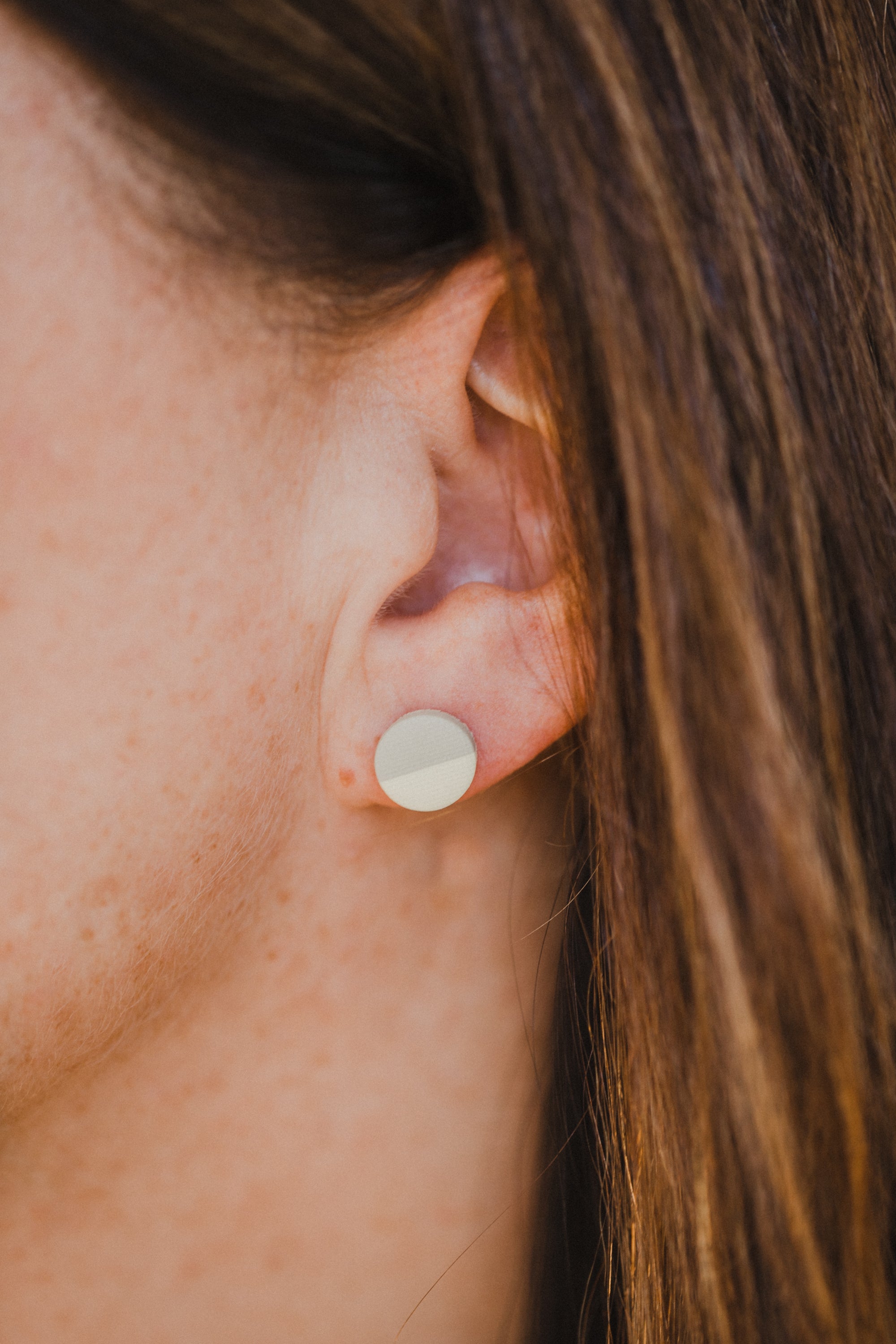 small round two-tone earrings made of polymer clay in pastel colors