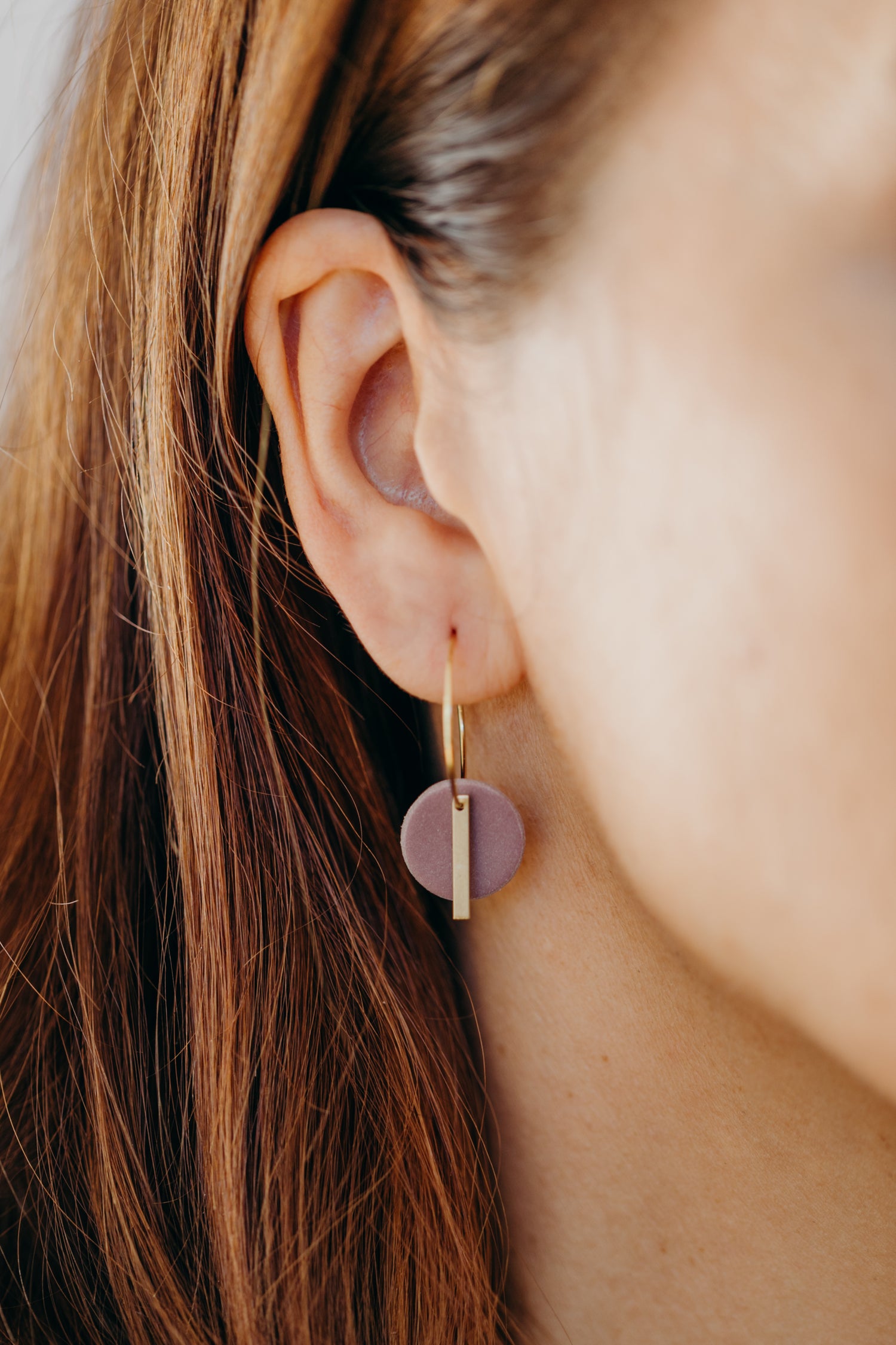 Hoop earrings with round polymer clay pendant and leaf