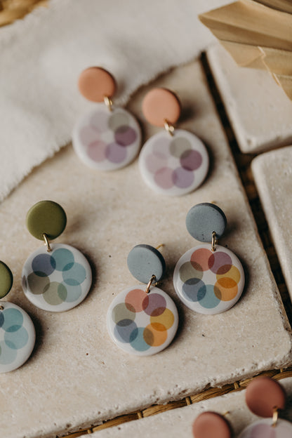 round blue polymer clay earrings with colorful dots