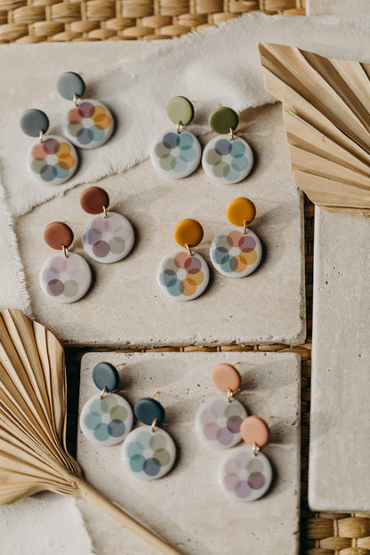 round blue polymer clay earrings with colorful dots