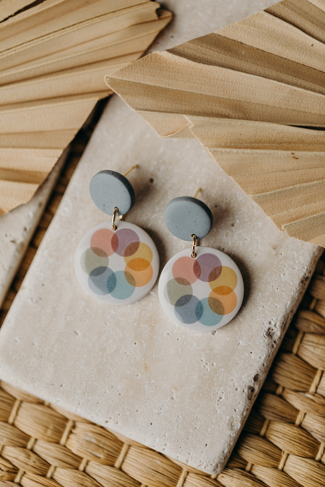 round blue polymer clay earrings with colorful dots