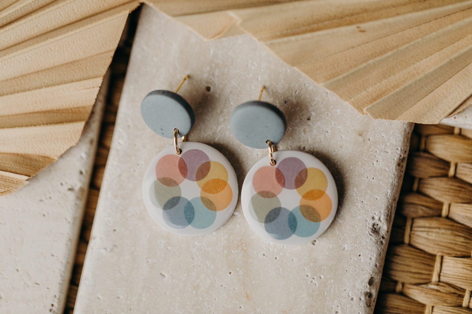 round blue polymer clay earrings with colorful dots