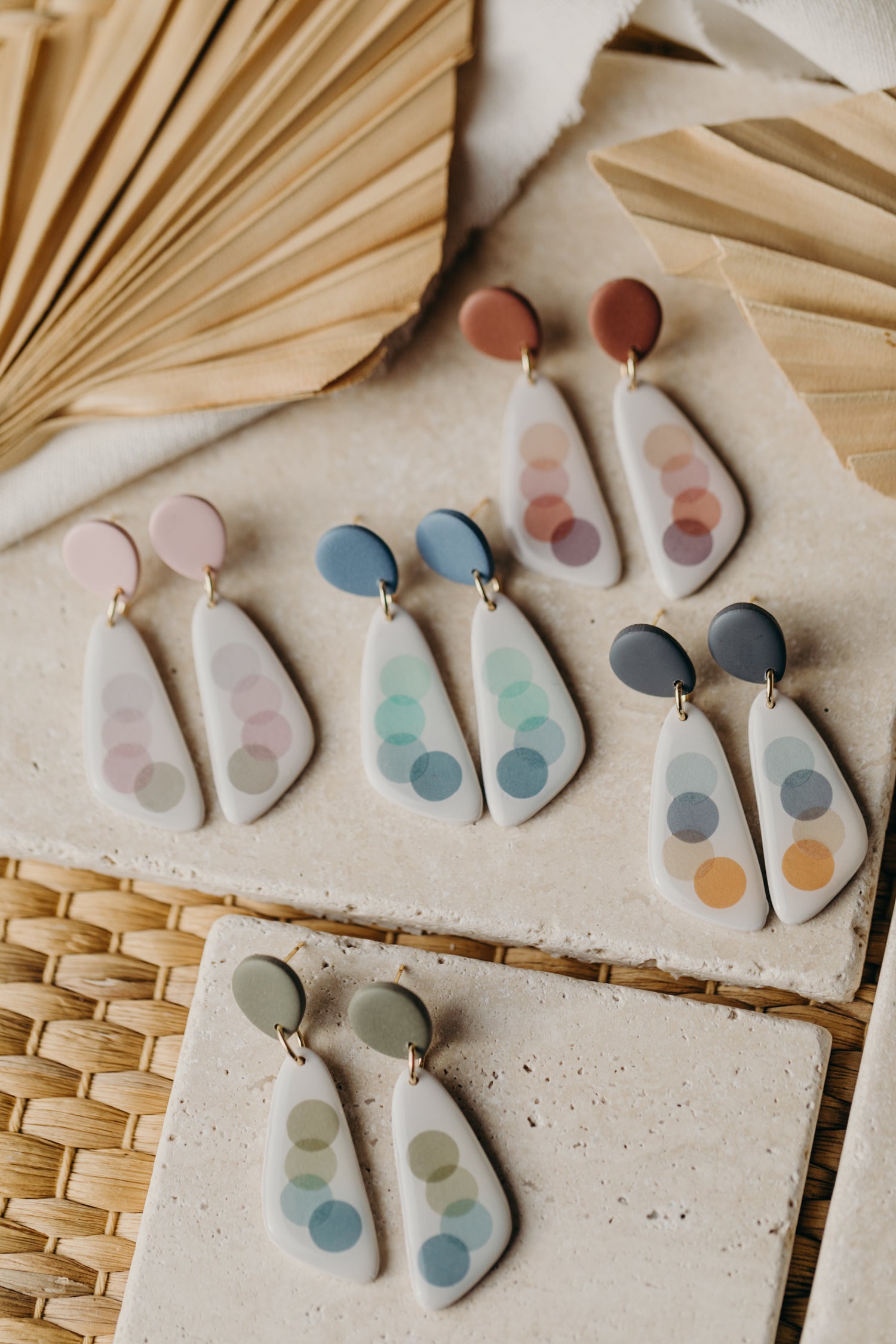 elongated blue polymer clay earrings with blue dots