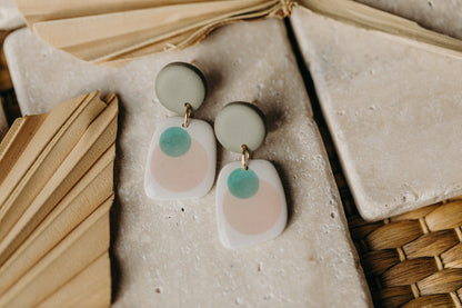 rectangular green polymer clay earrings with green and apricot dots