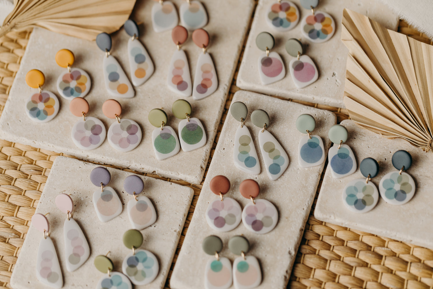 round blue polymer clay earrings with colorful dots