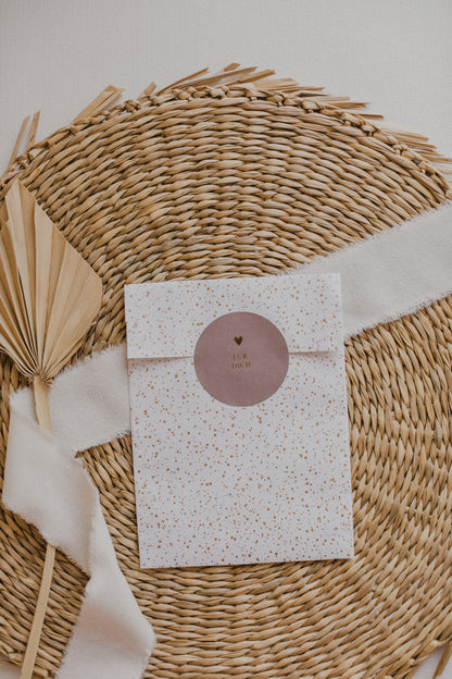 large white paper bag with golden dots