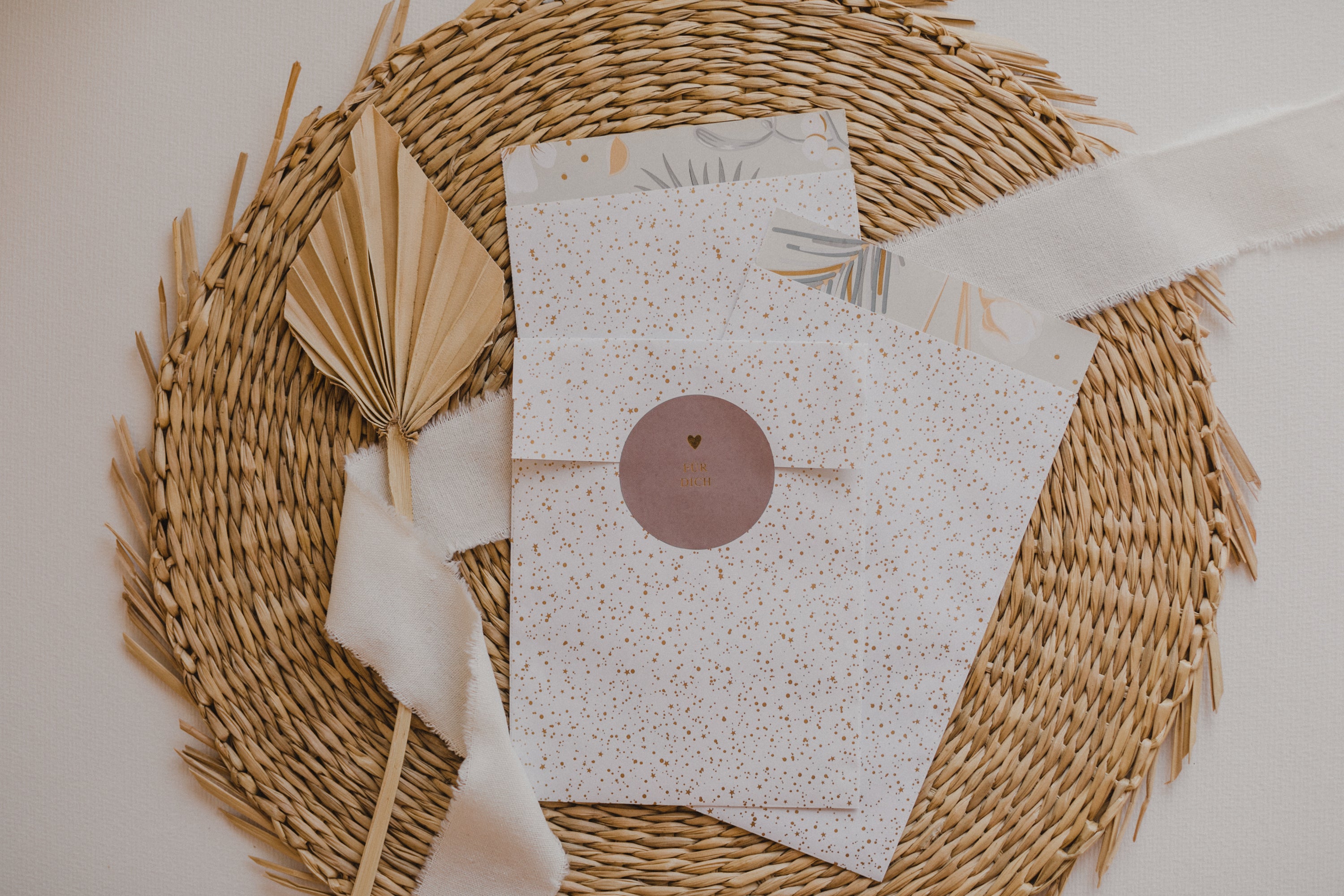 large white paper bag with golden dots