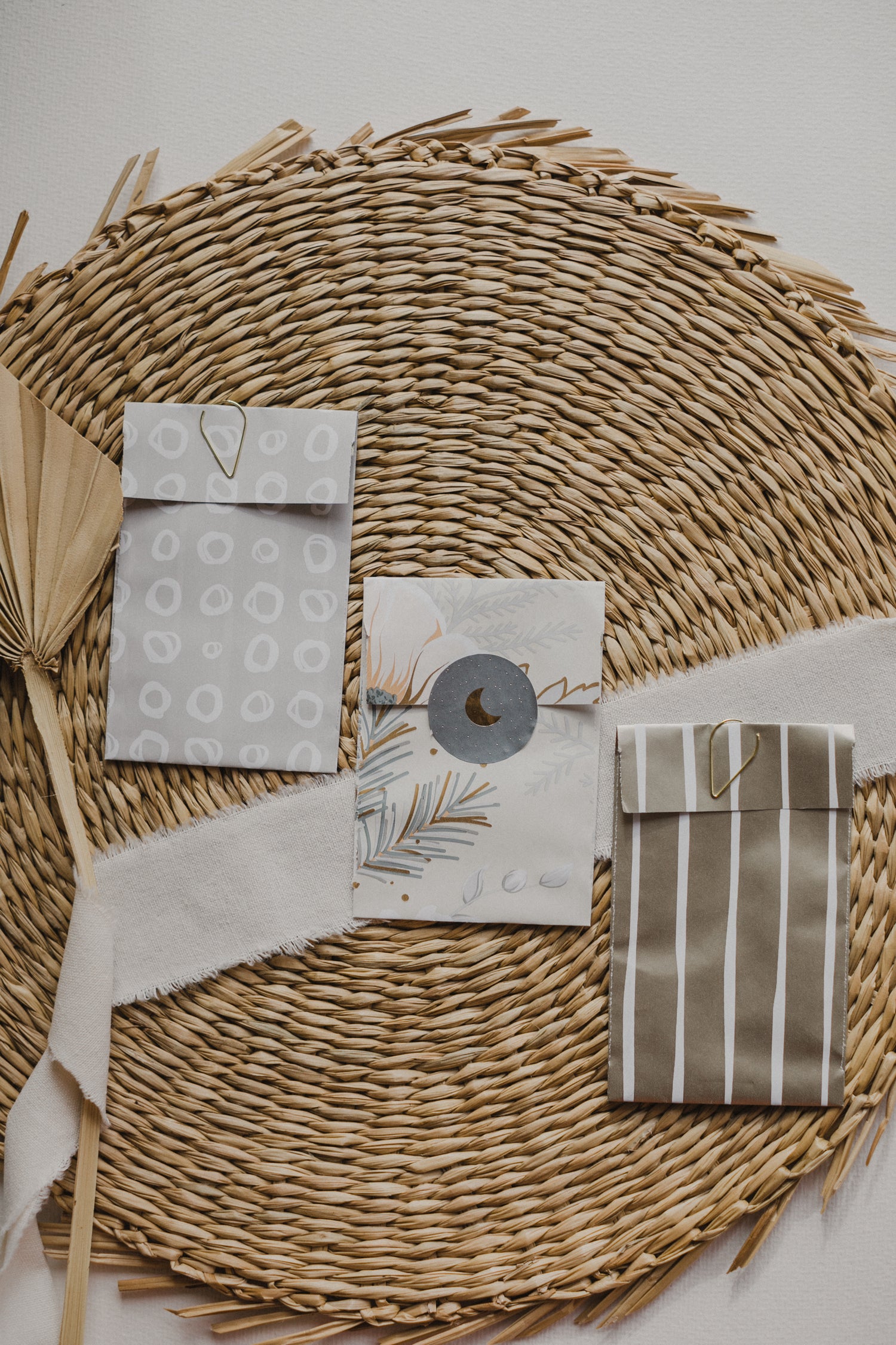 small gray paper bag with white circles