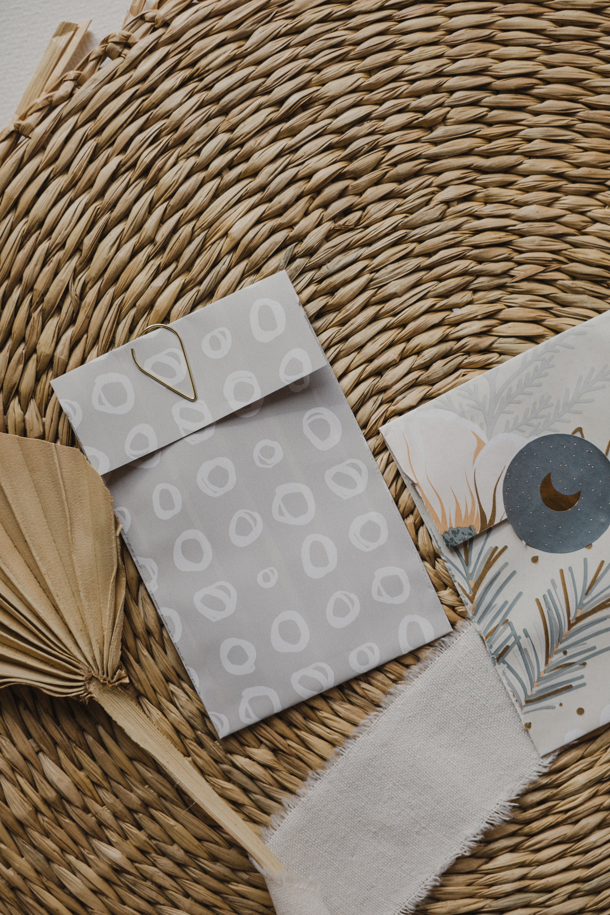 small gray paper bag with white circles