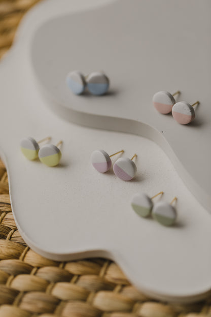 small round two-tone earrings made of polymer clay in pastel colors