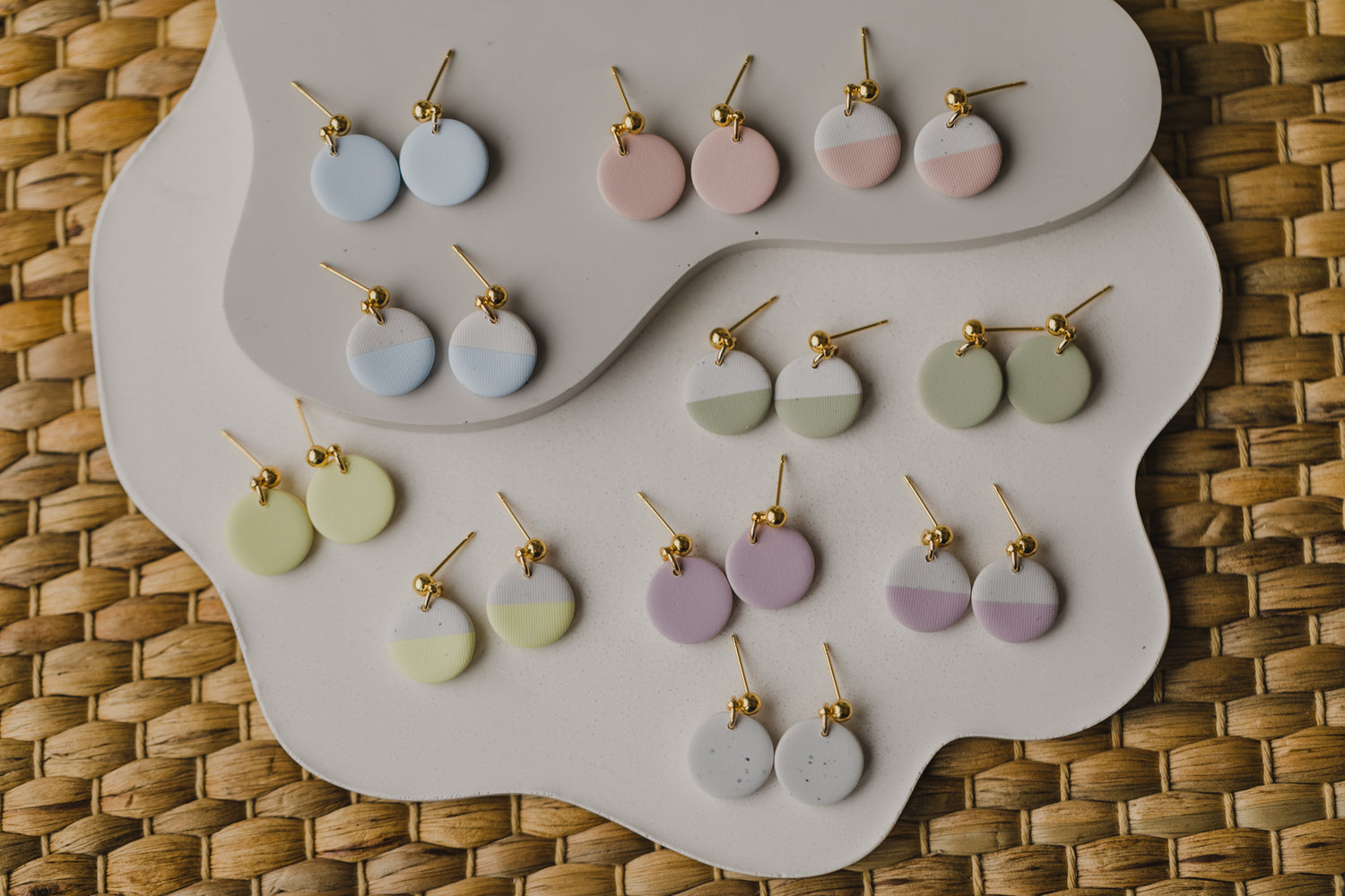 round two-tone earrings made of polymer clay in pastel colors