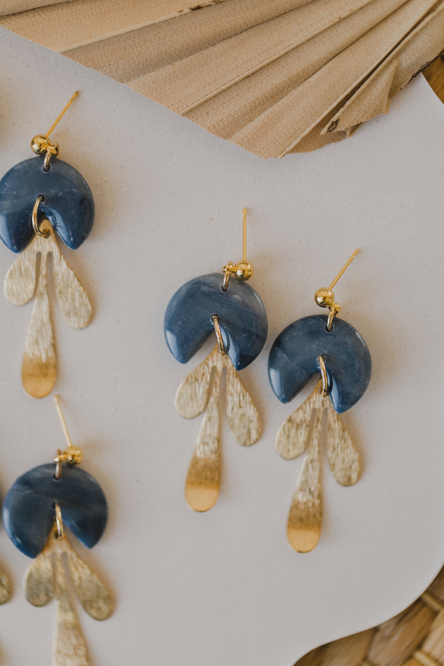 Hoop earrings with round polymer clay pendant and leaf