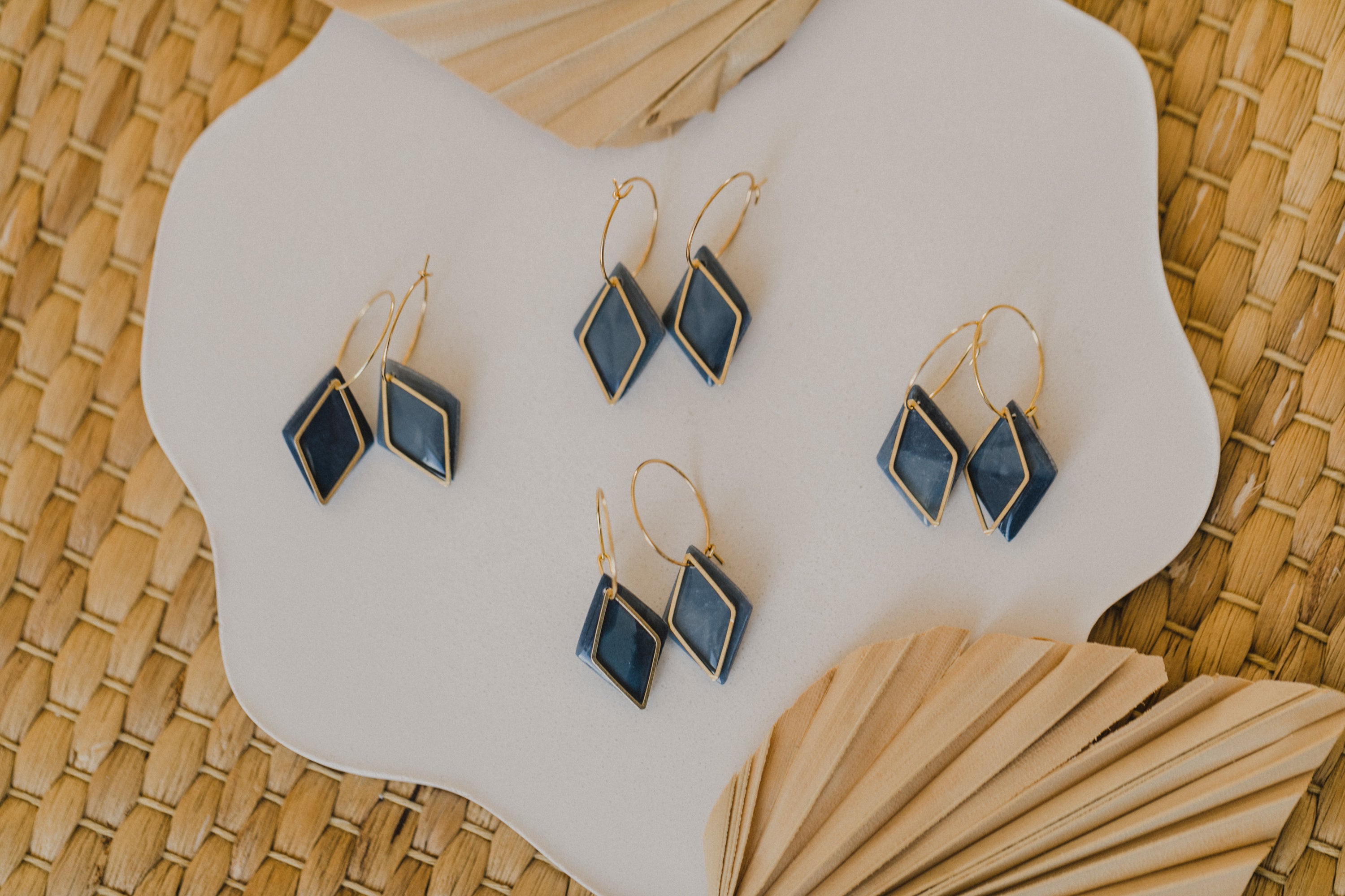 Hoop earrings with round polymer clay pendant and leaf