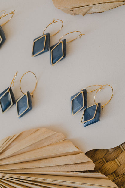 Hoop earrings with round polymer clay pendant and leaf