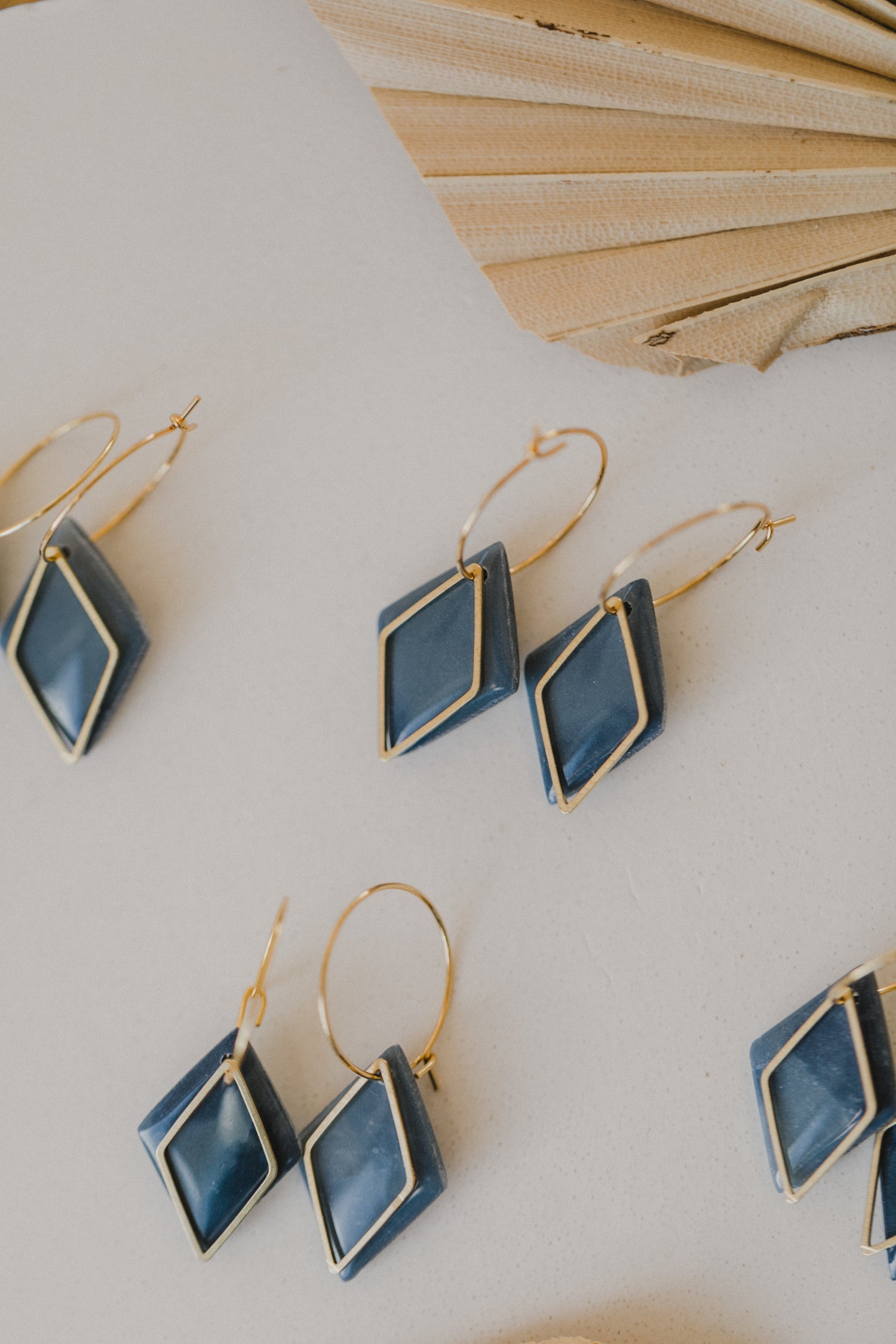 Hoop earrings with round polymer clay pendant and leaf