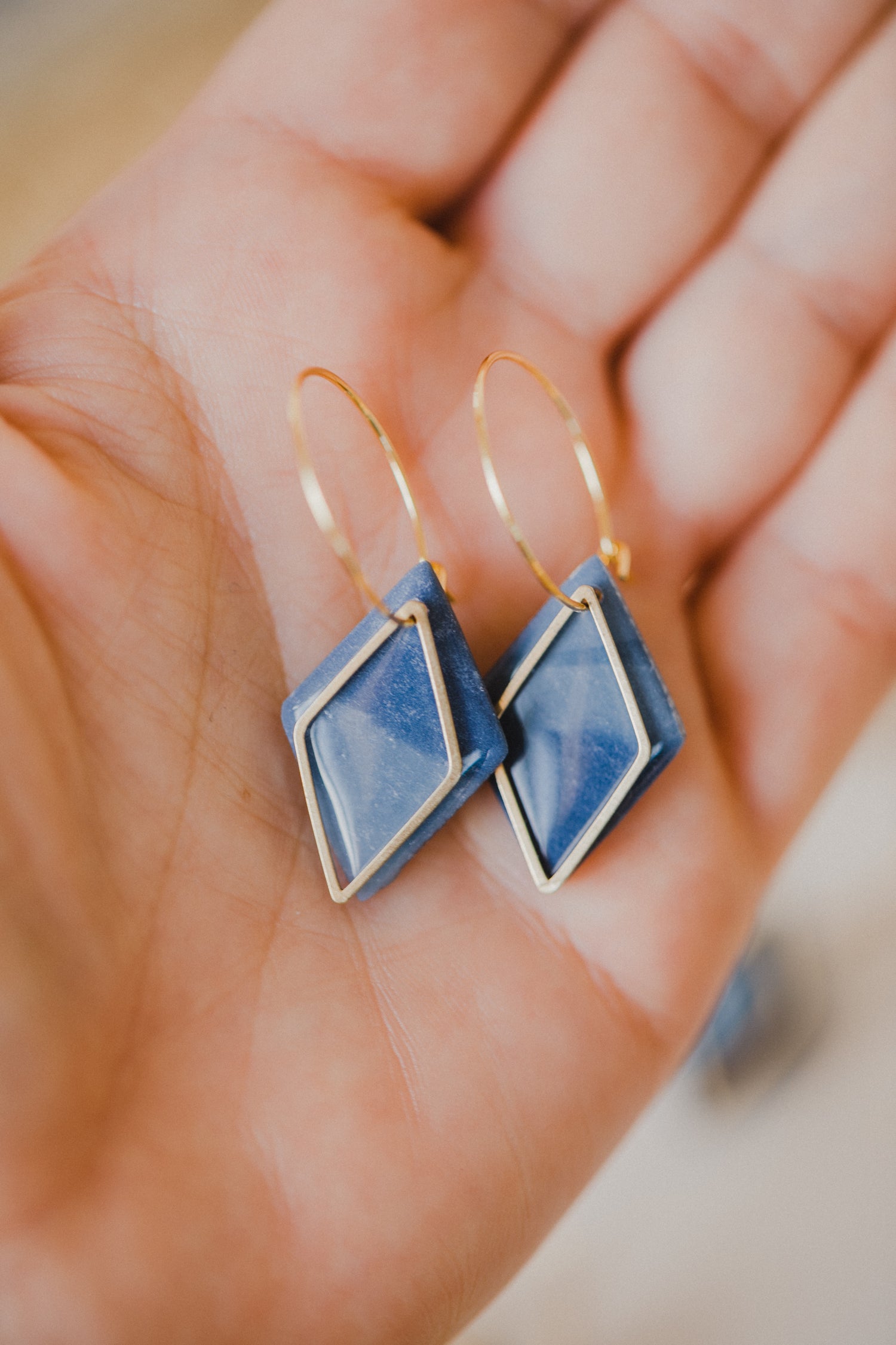 Hoop earrings with round polymer clay pendant and leaf