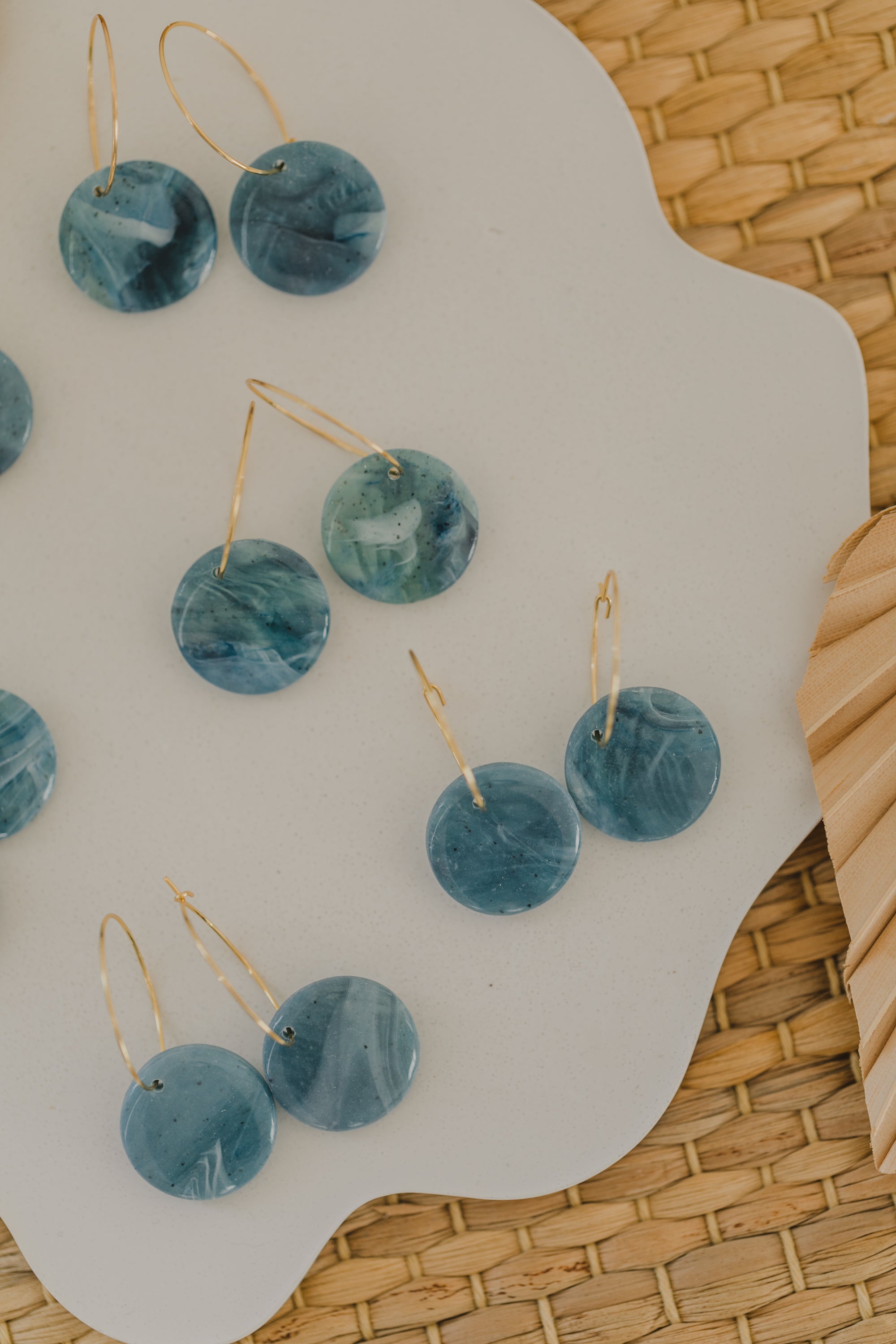 Hoop earrings with round polymer clay pendant and leaf