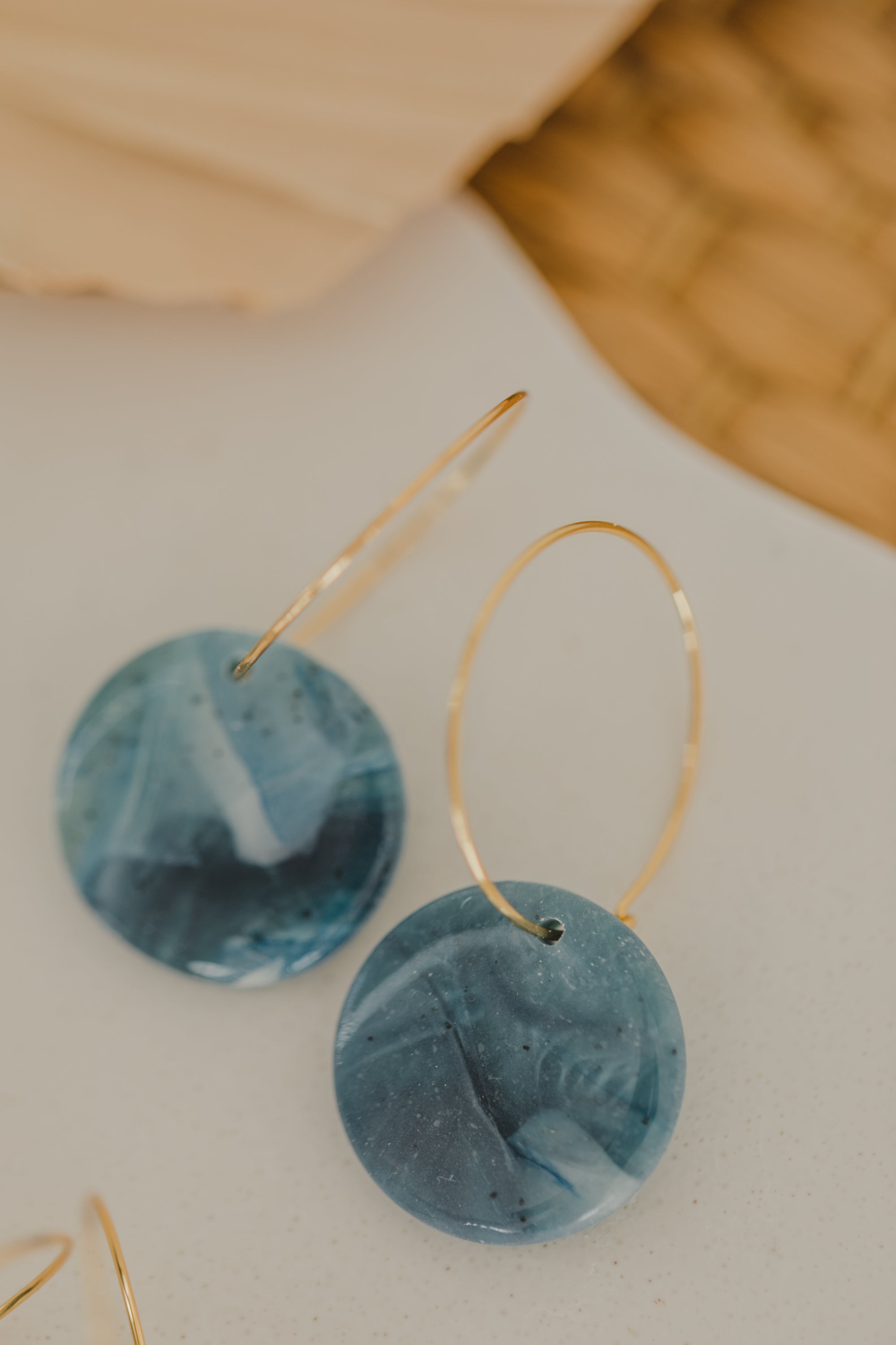 Hoop earrings with round polymer clay pendant and leaf