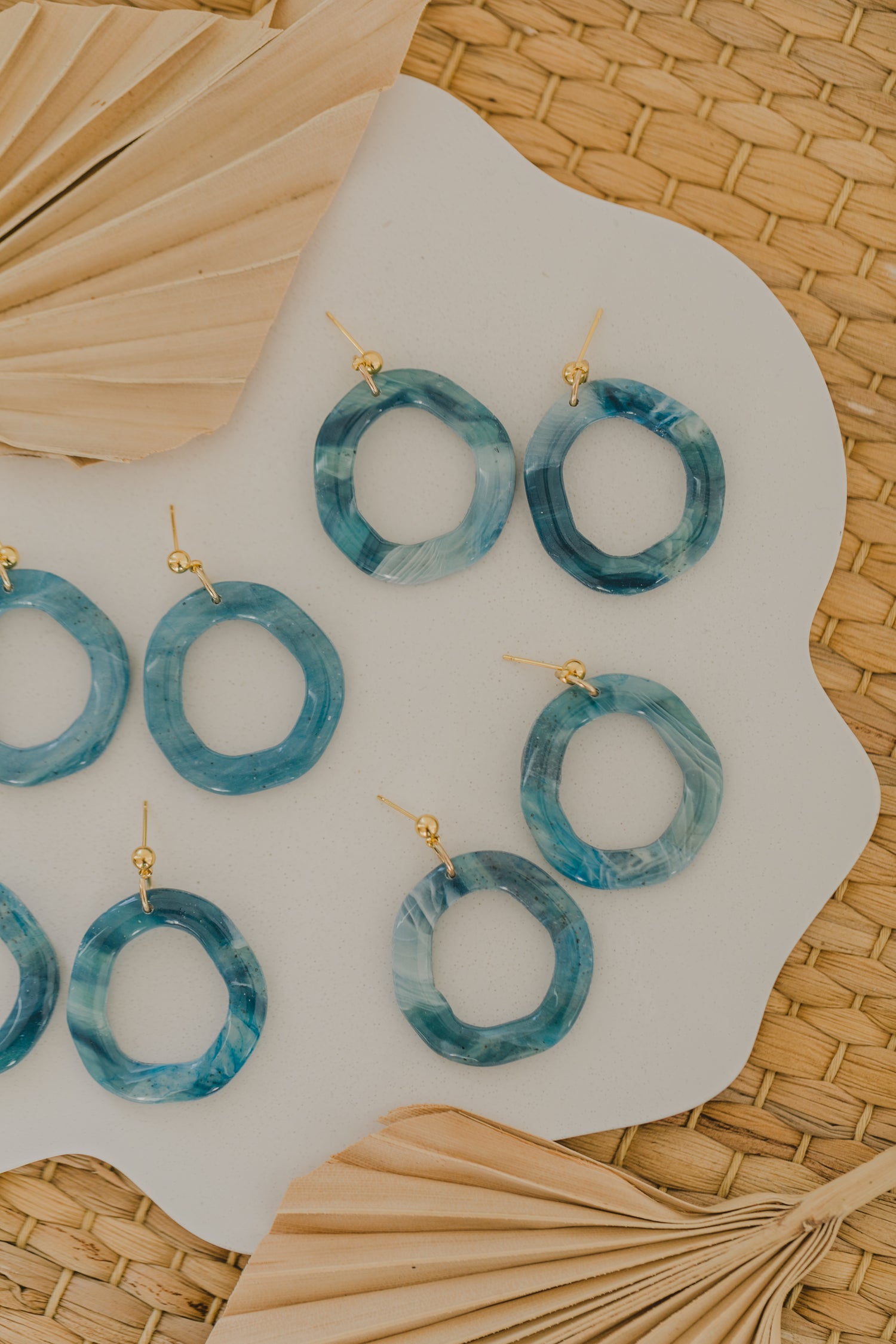 Hoop earrings with round polymer clay pendant and leaf