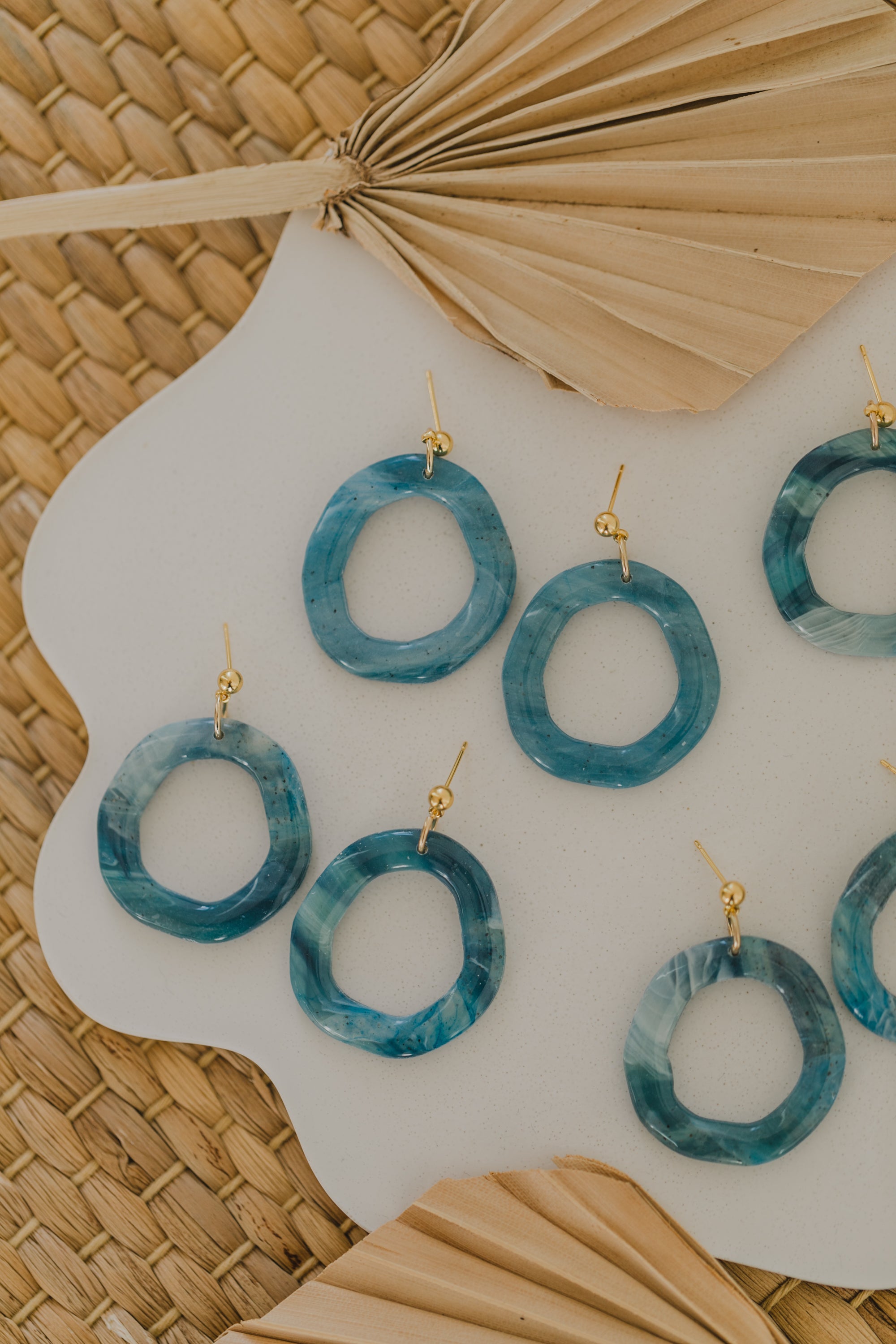 Hoop earrings with round polymer clay pendant and leaf