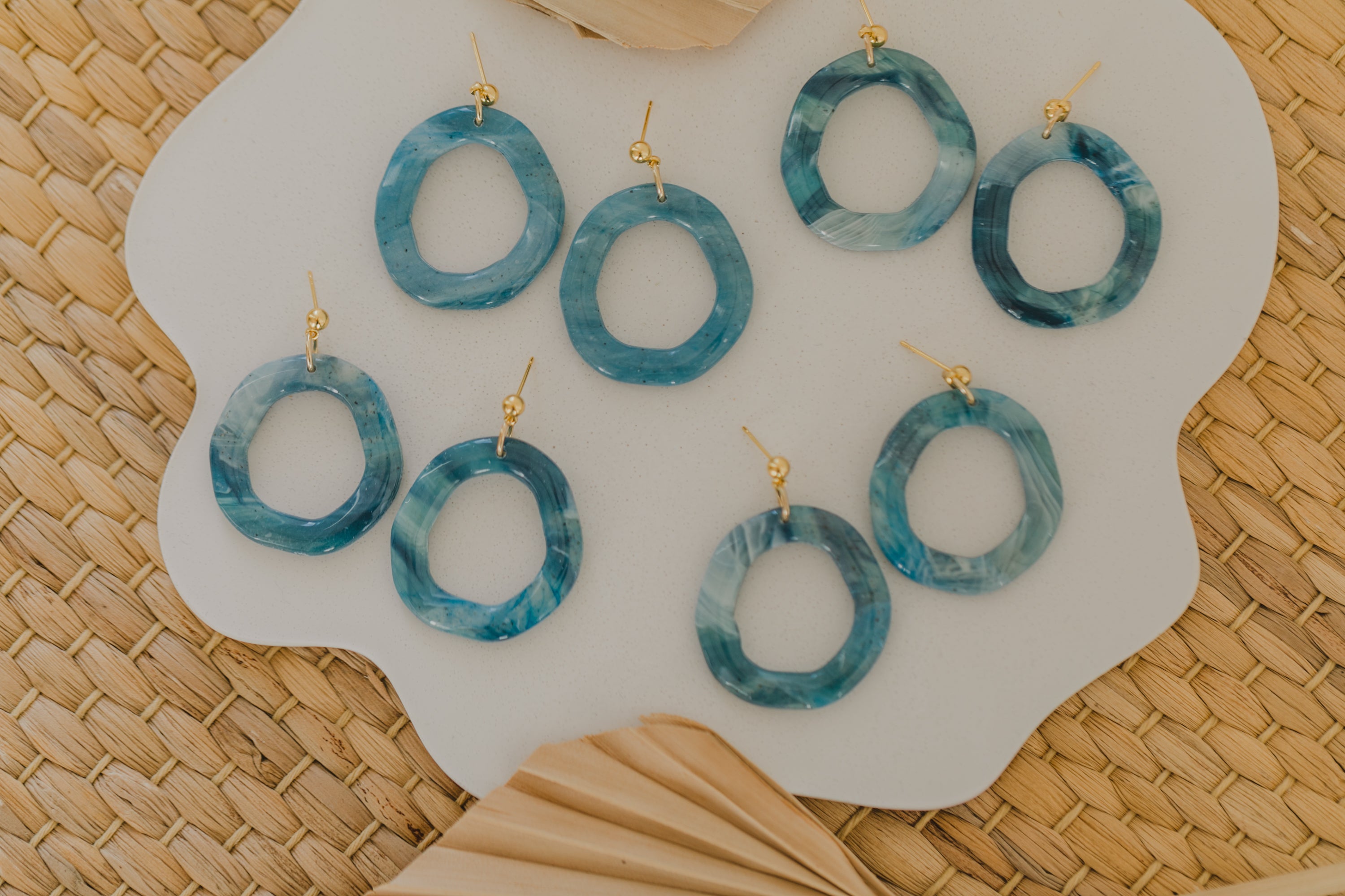 Hoop earrings with round polymer clay pendant and leaf