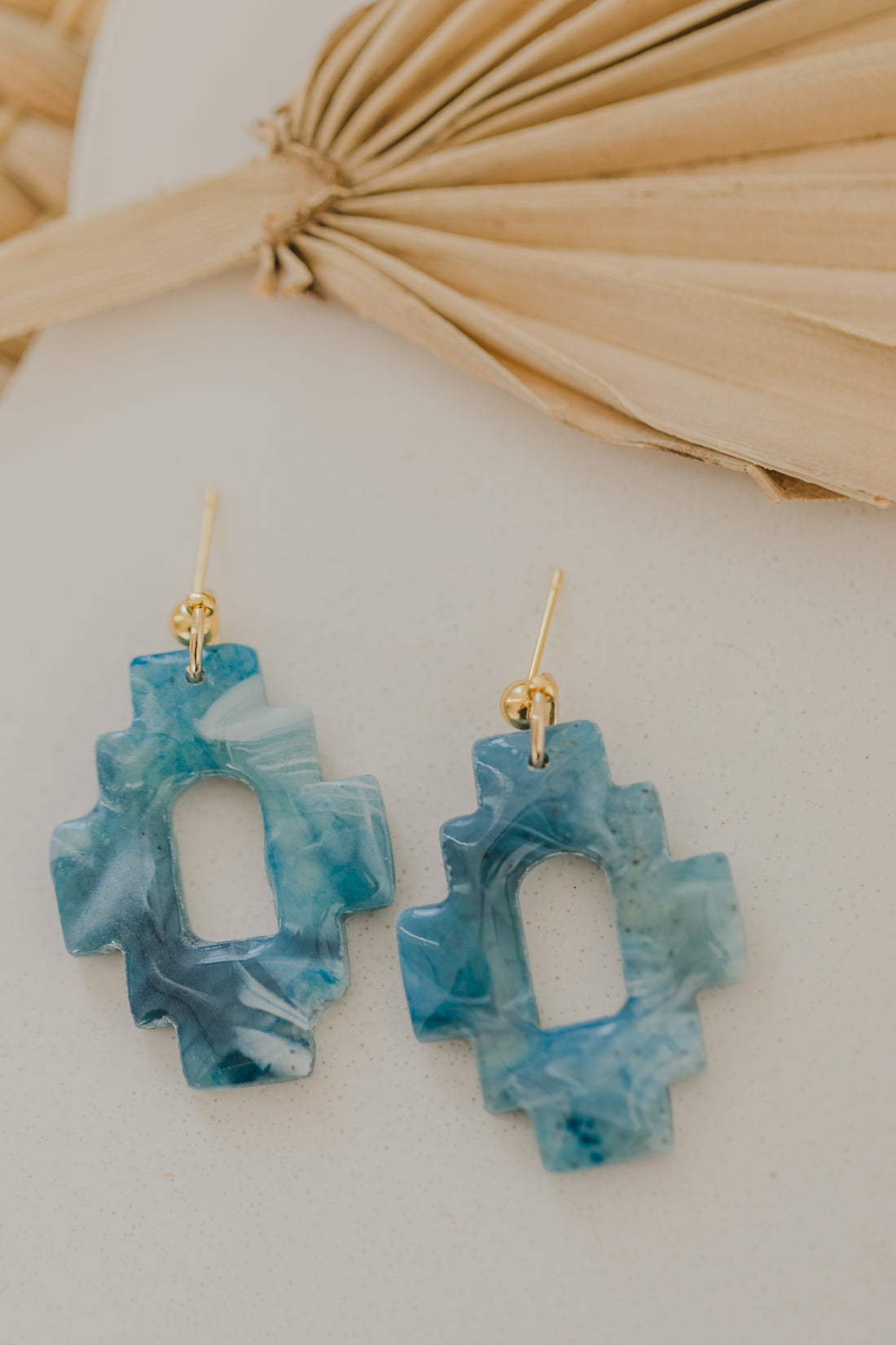 Hoop earrings with round polymer clay pendant and leaf