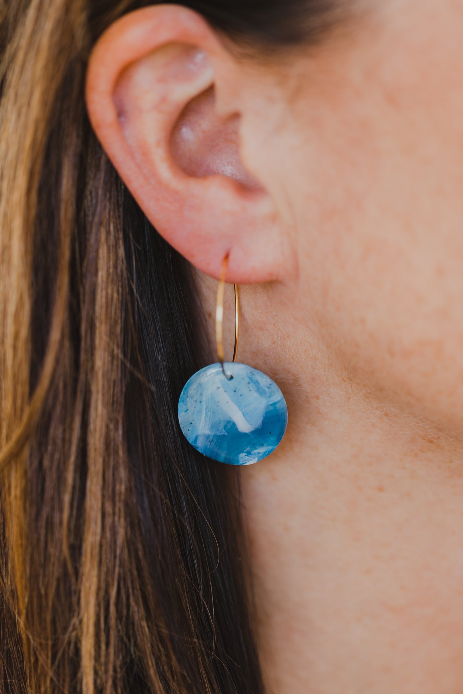 Hoop earrings with round polymer clay pendant and leaf