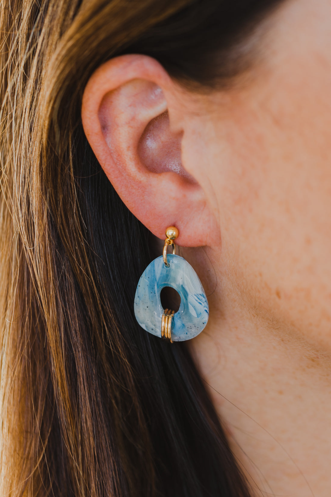 Hoop earrings with round polymer clay pendant and leaf