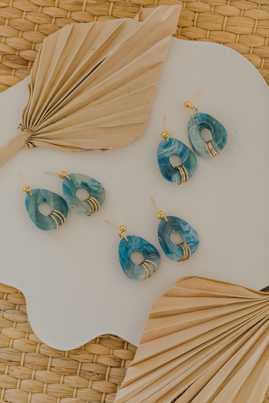 Hoop earrings with round polymer clay pendant and leaf