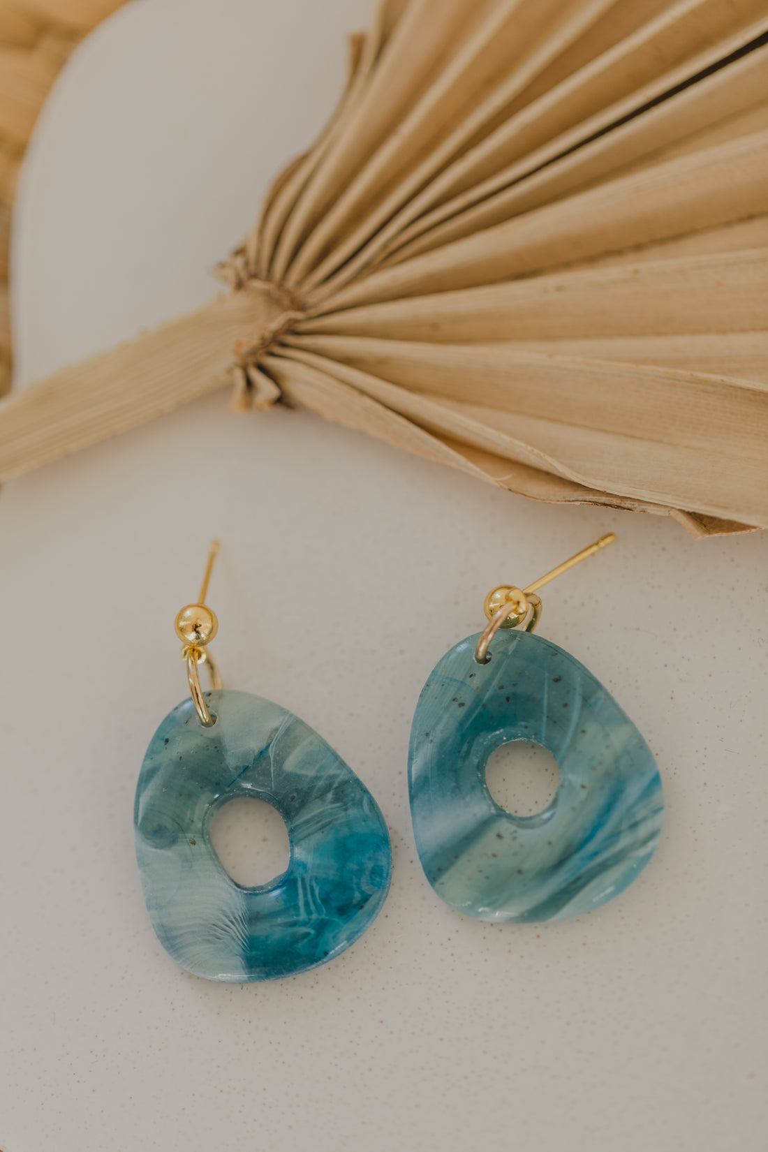 Hoop earrings with round polymer clay pendant and leaf