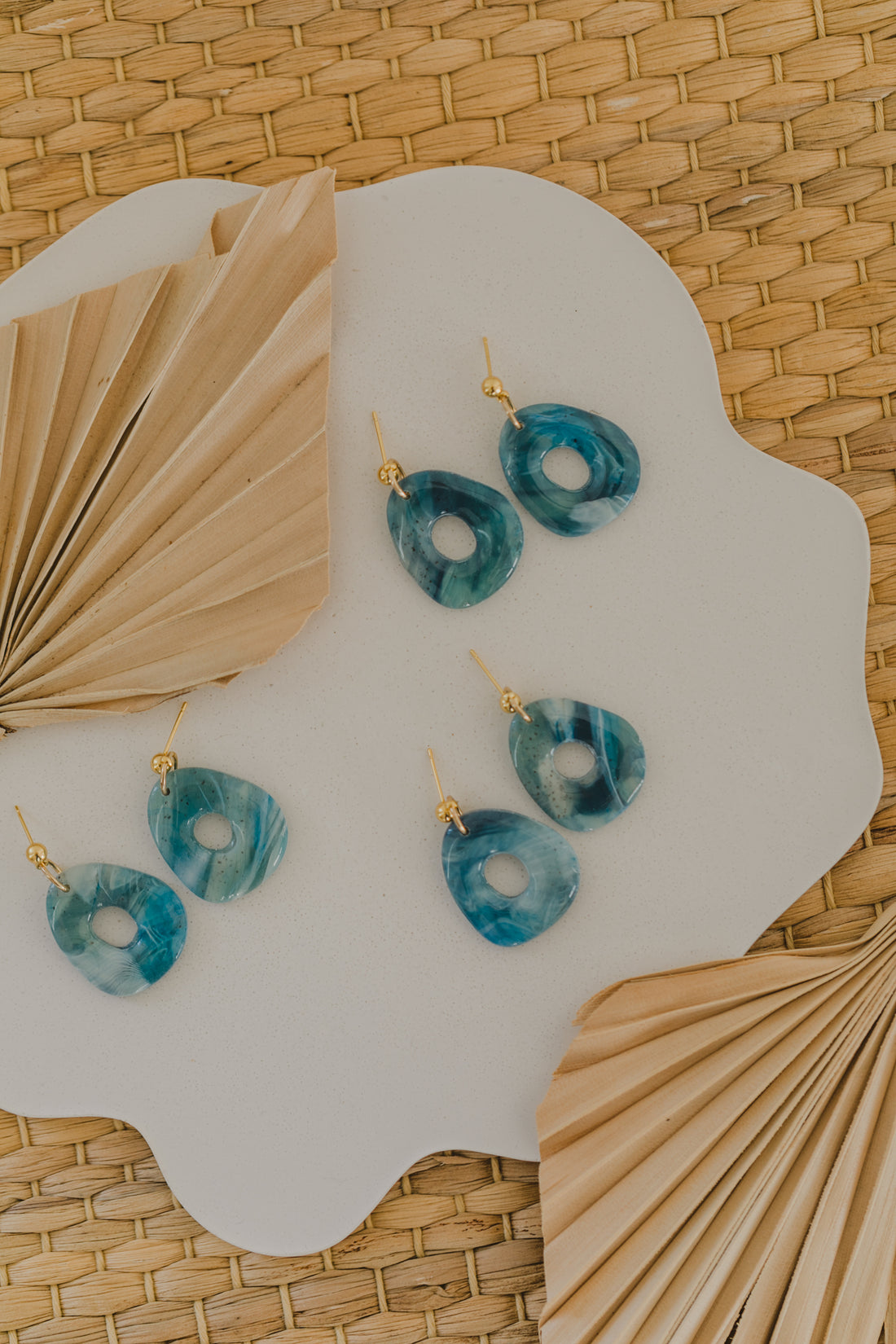 Hoop earrings with round polymer clay pendant and leaf