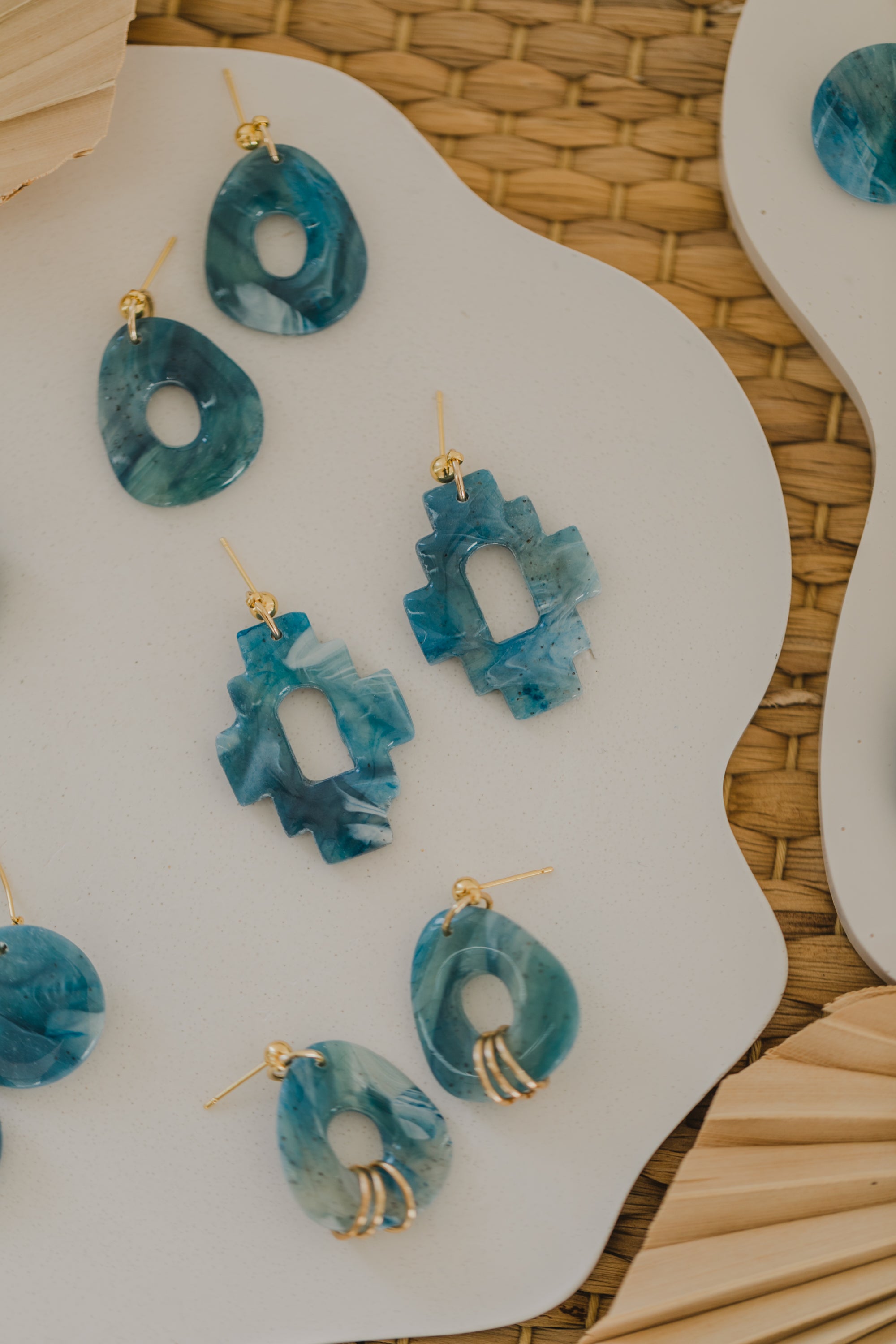 Hoop earrings with round polymer clay pendant and leaf