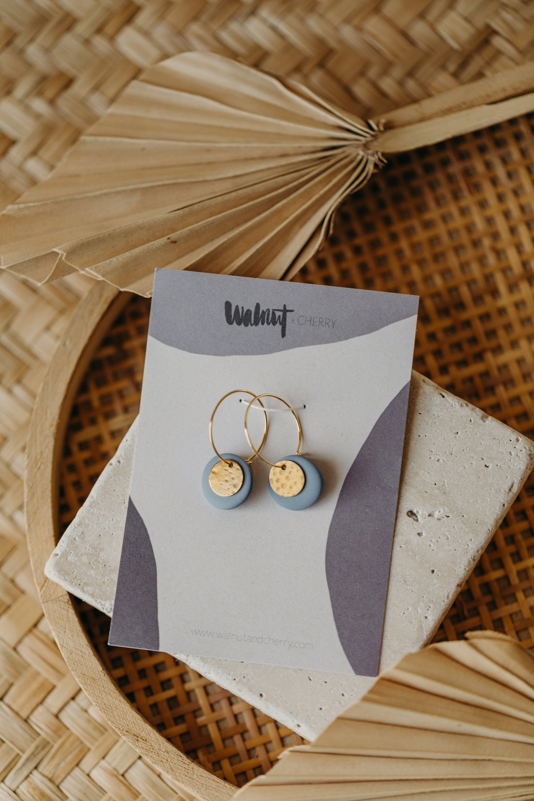 Hoop earrings with round polymer clay pendant and leaf