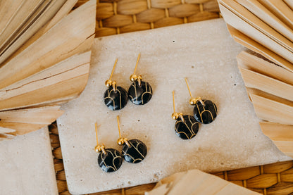 small round black polymer clay earrings