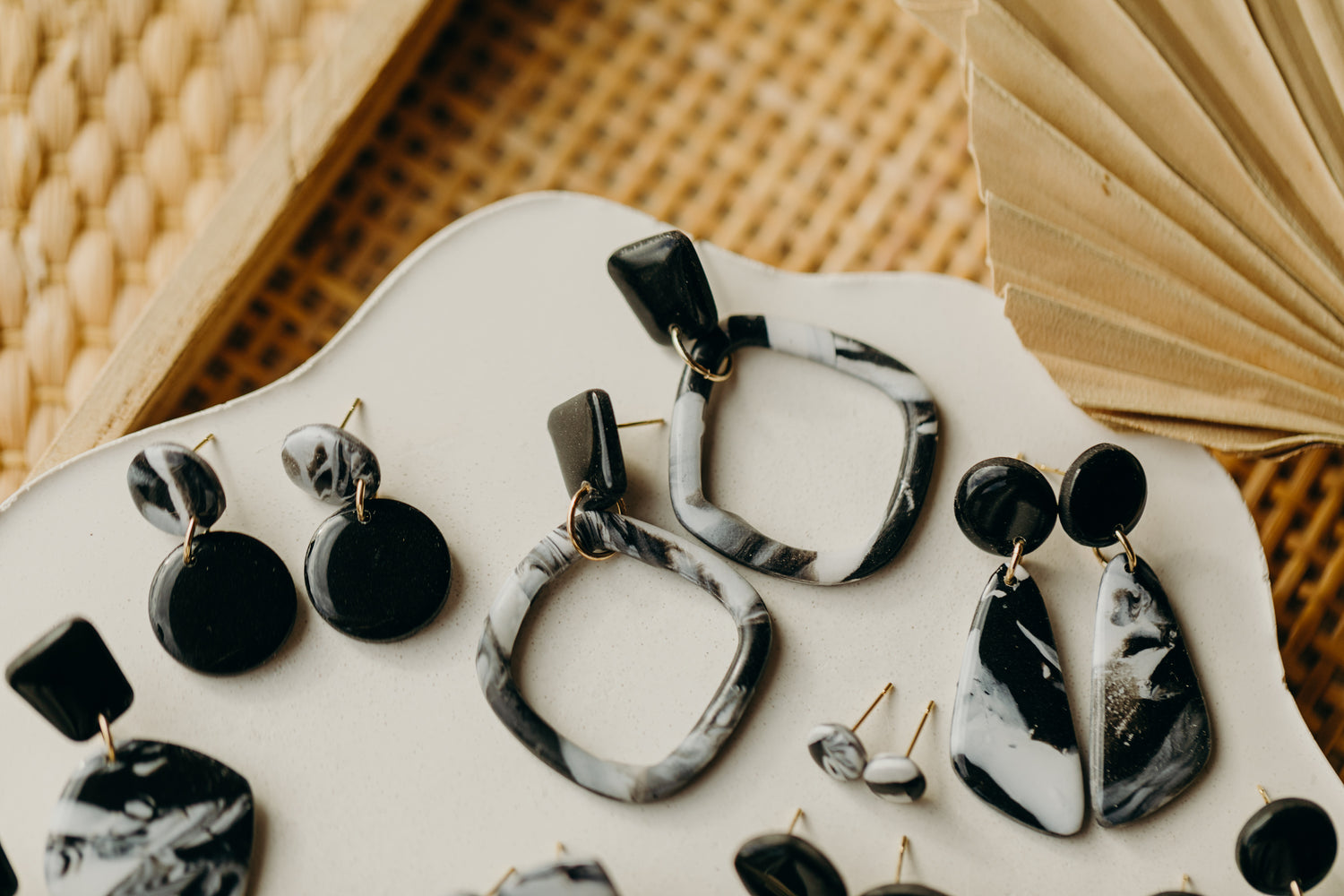 black polymer clay earrings with white pattern