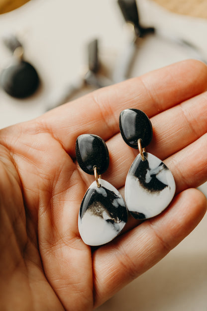 black polymer clay earrings with white pattern