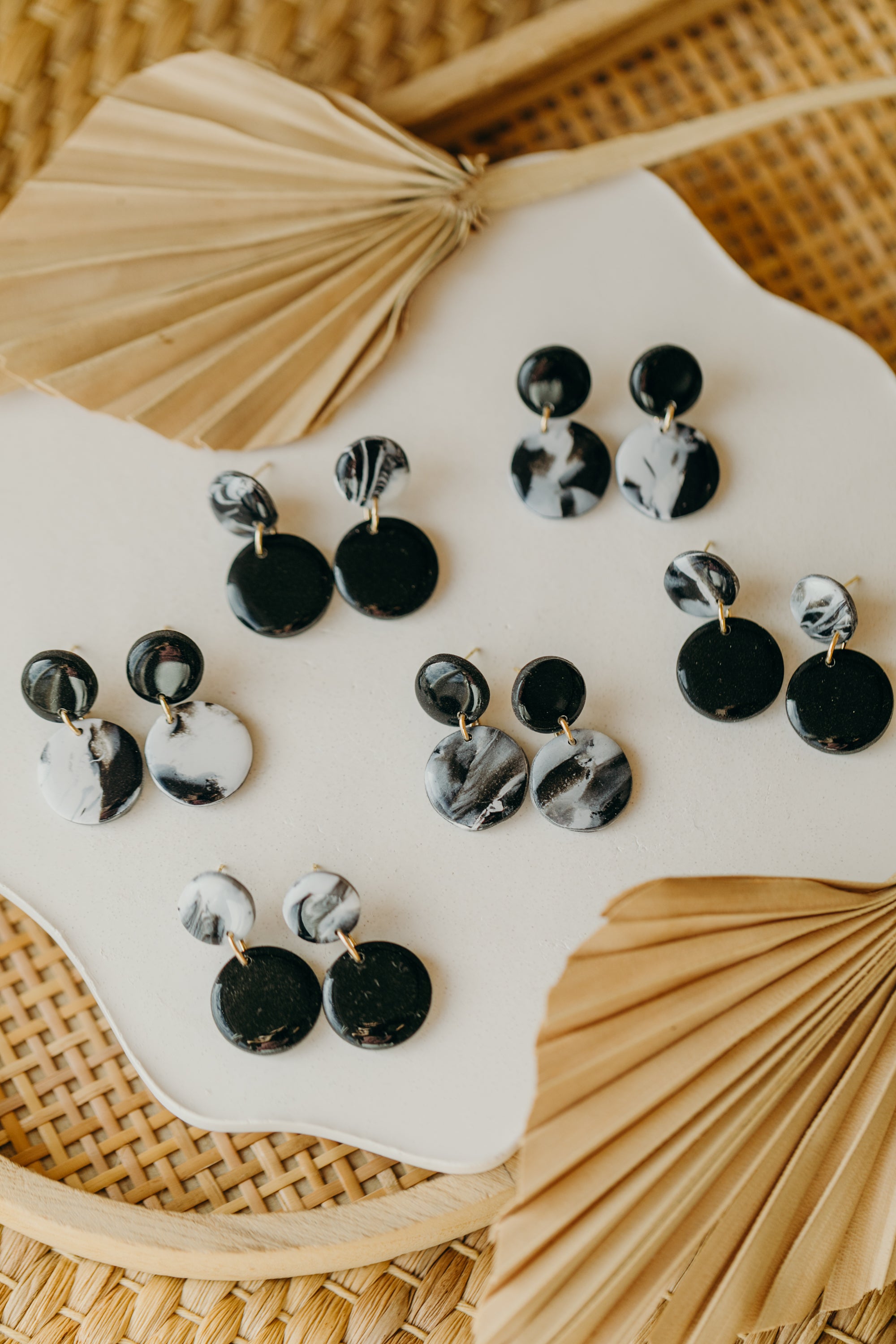 black polymer clay earrings with white pattern