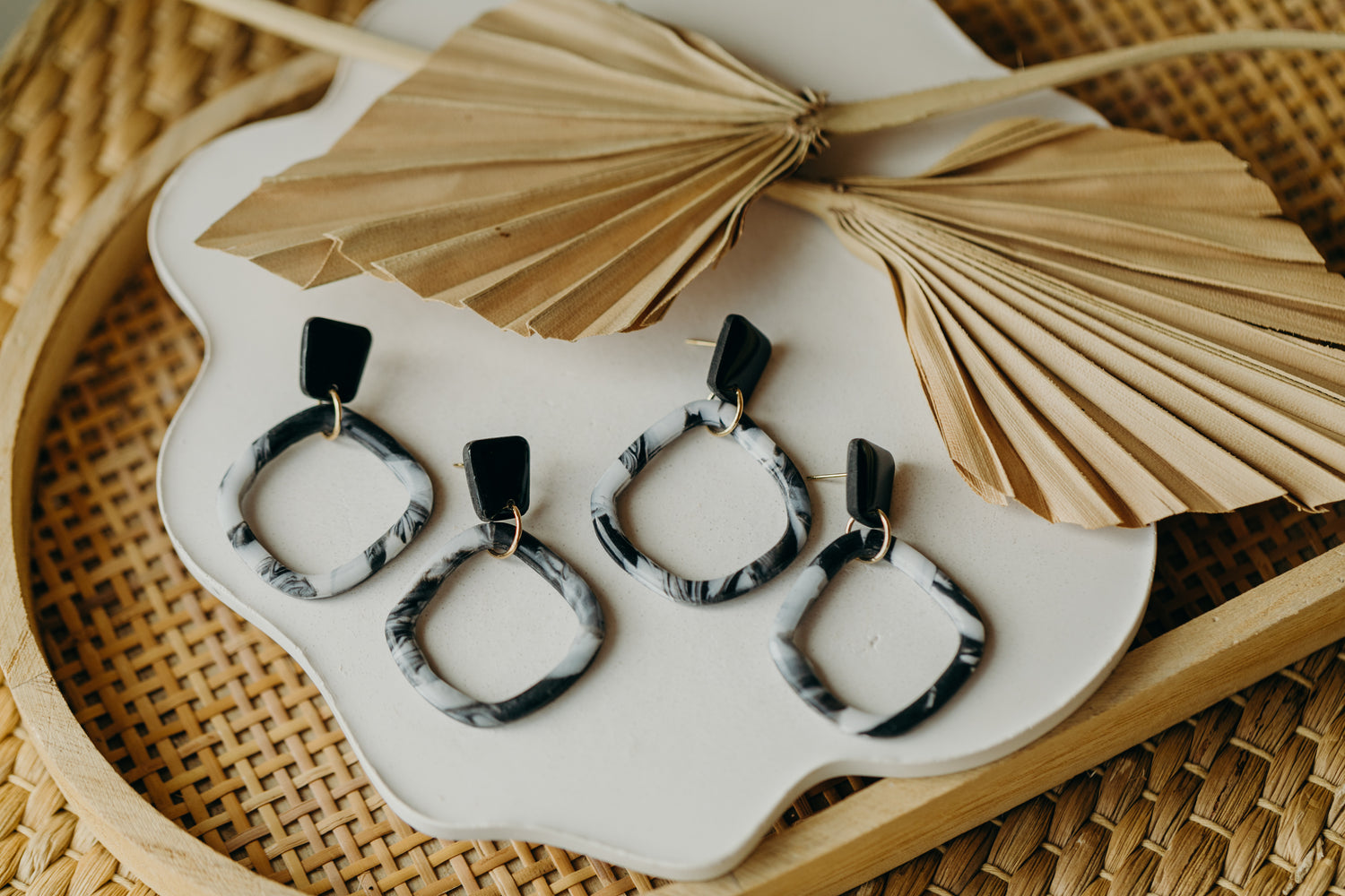 black polymer clay earrings with white pattern