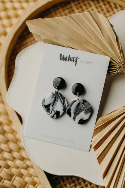 black polymer clay earrings with white pattern