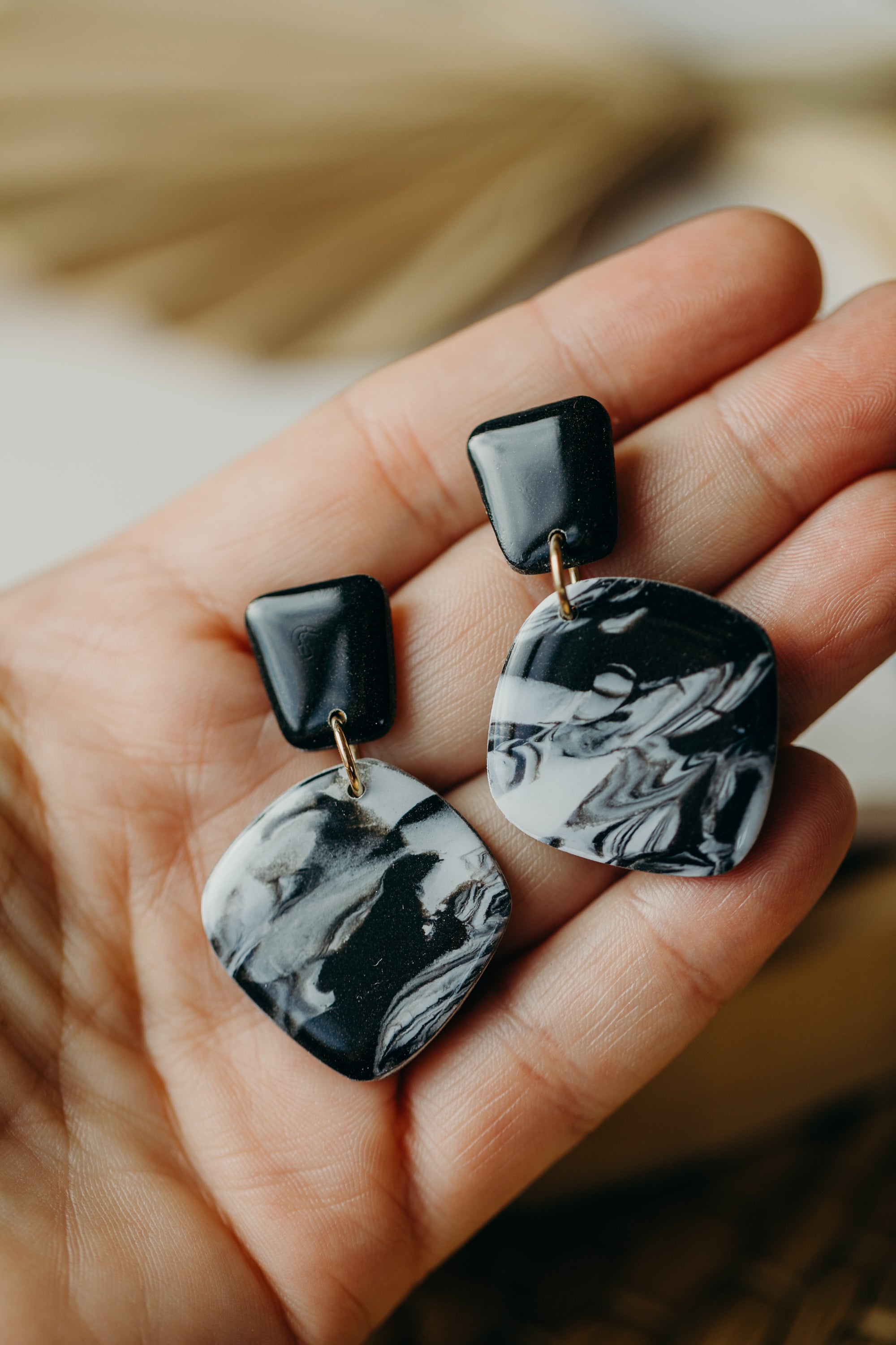 black polymer clay earrings with white pattern