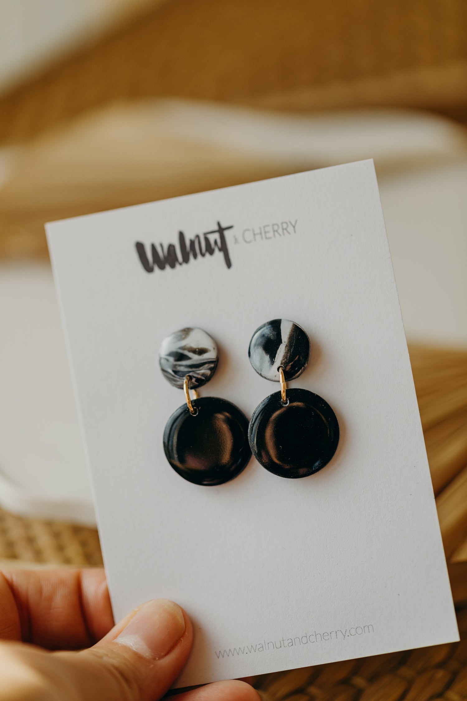 black polymer clay earrings with white pattern